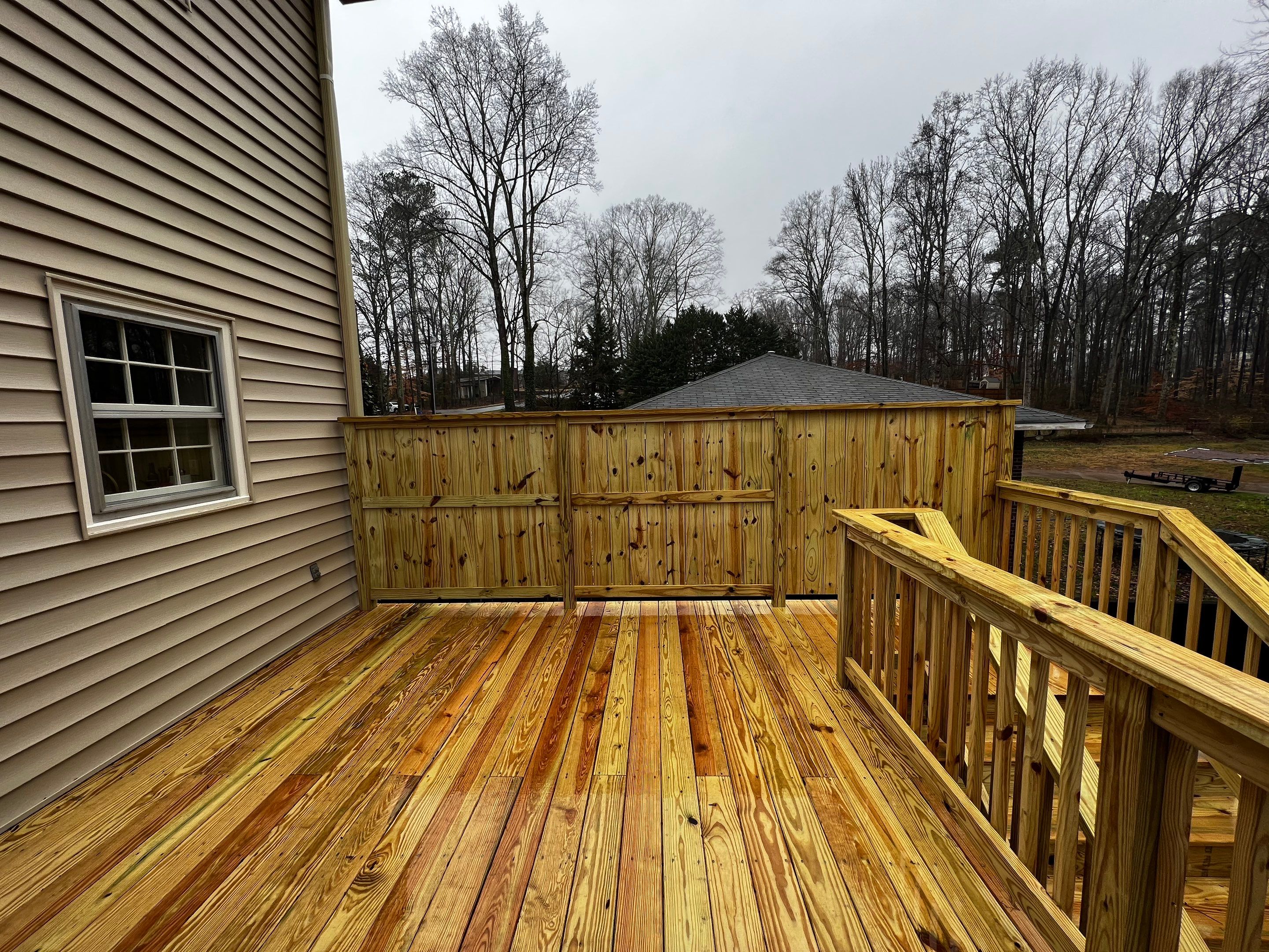 Custom Screened-In Porch and Elevated Deck Construction in Smyrna by Swift Home Renovations