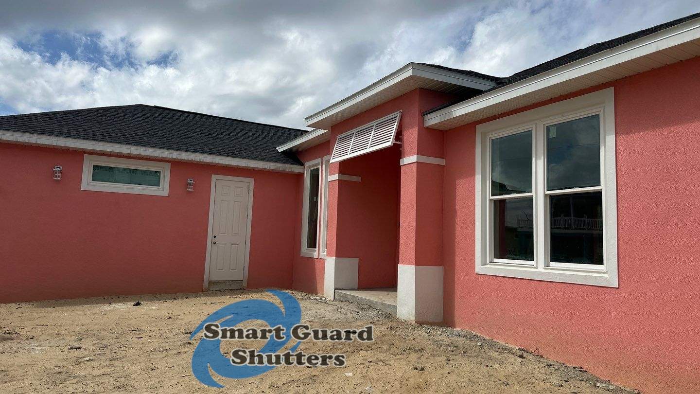 Decorative Bahama Shutter in Traffic White by Smart Guard Shutters