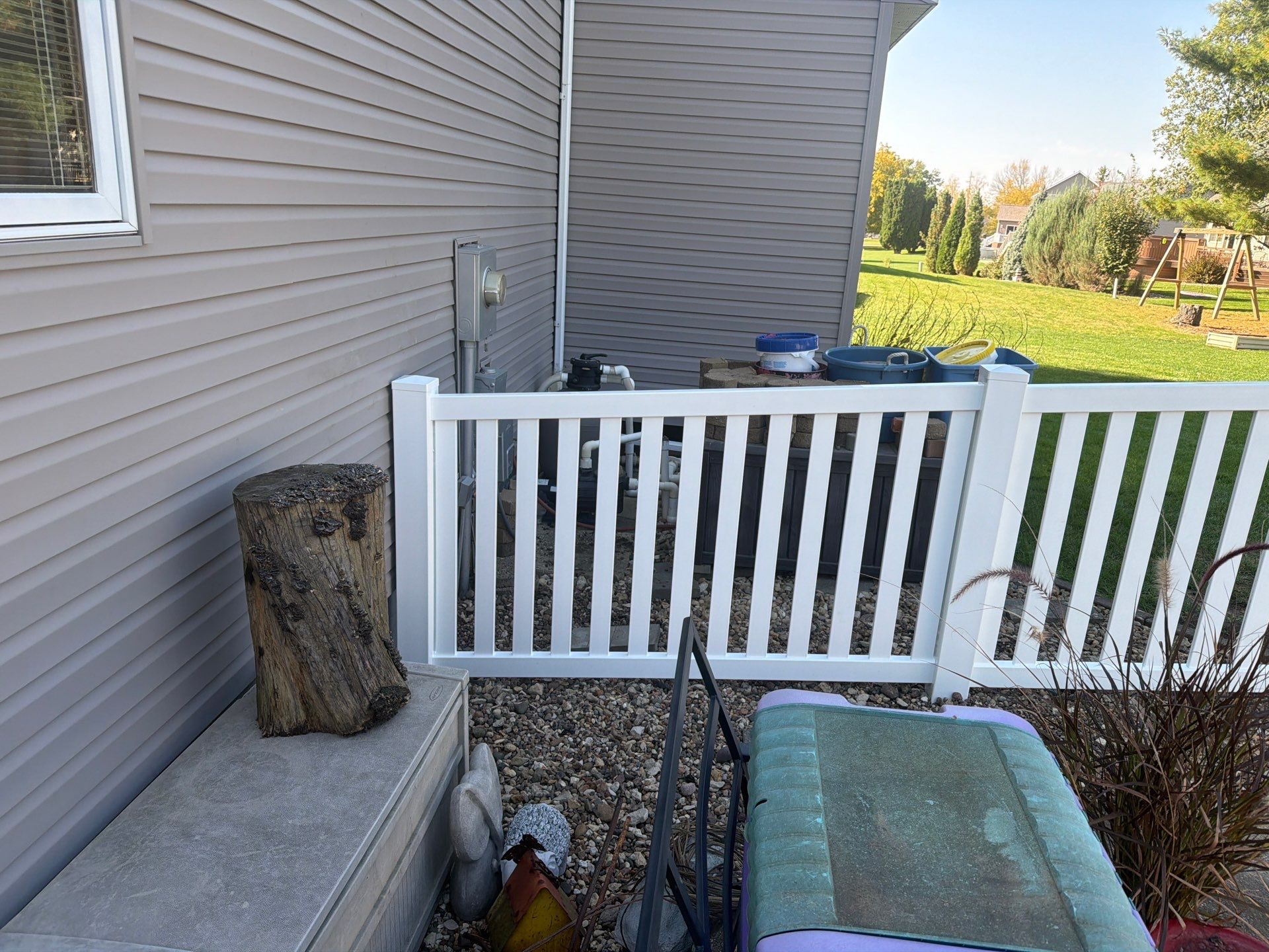 White Vinyl Picket Pool Fence Installation in Waterloo, Iowa by Perfect Picket Fence and Stain