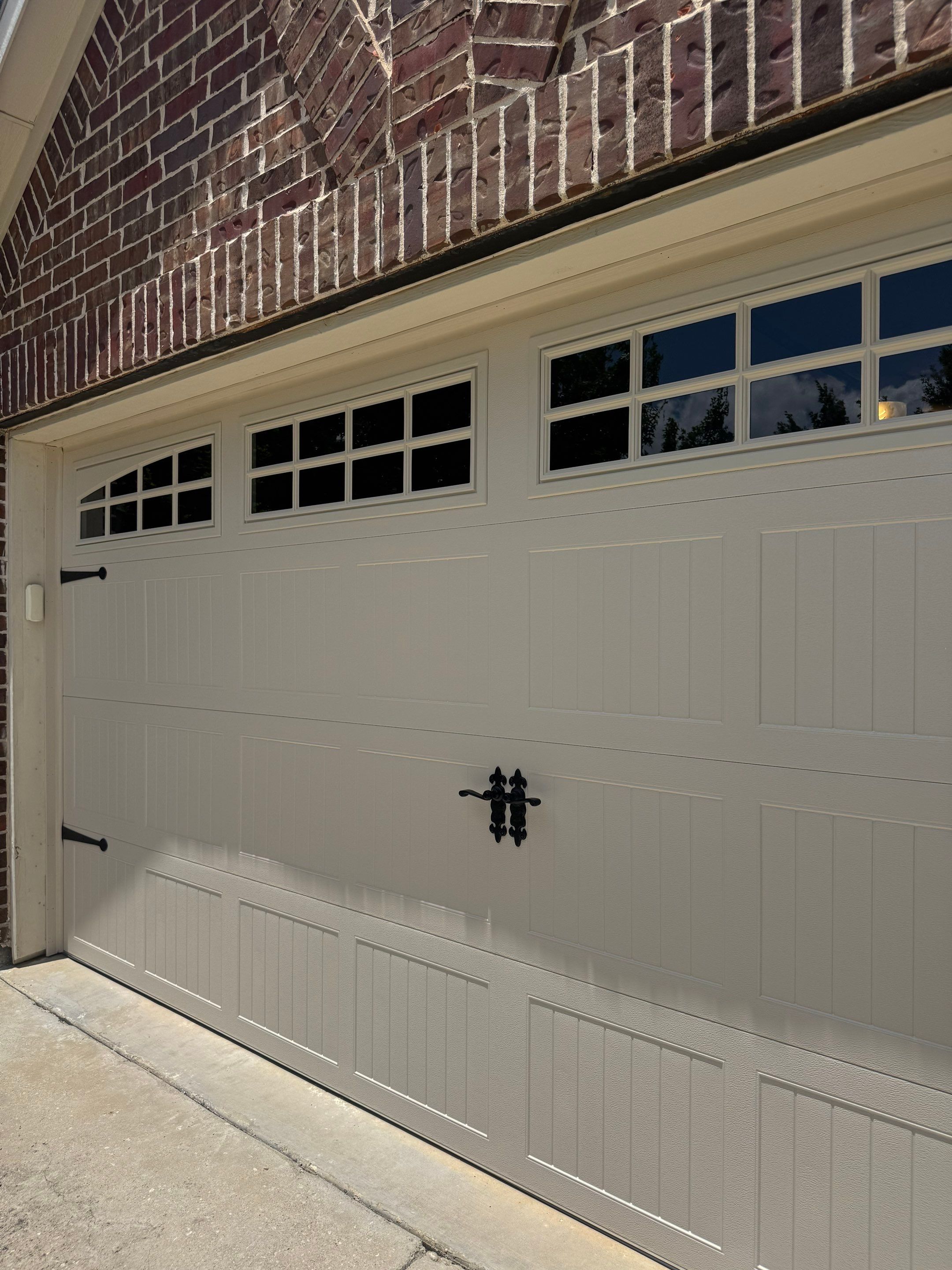 CHI Carriage Stamp Garage Door Installation With Decorative Hardware In Roanoke by Meadows Garage Doors