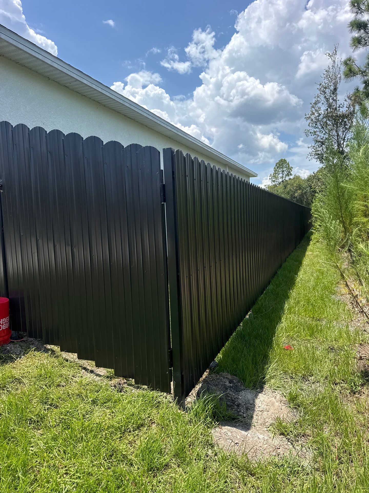 Black Scalloped Metal Privacy Fence Installation in Punta Gorda by True Fence LLC