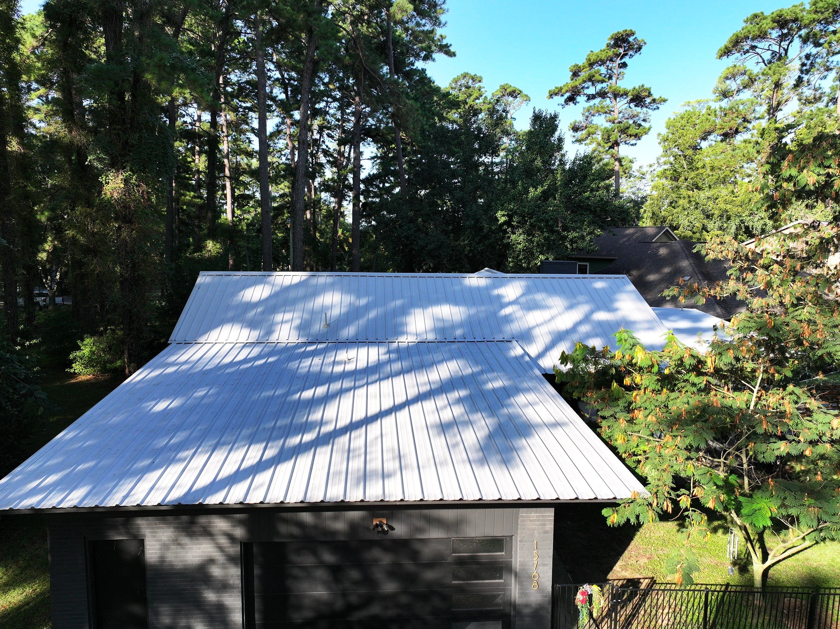 White Standing Seam Metal Roof Replacement in Willis, Texas by Abbott Roofing Company