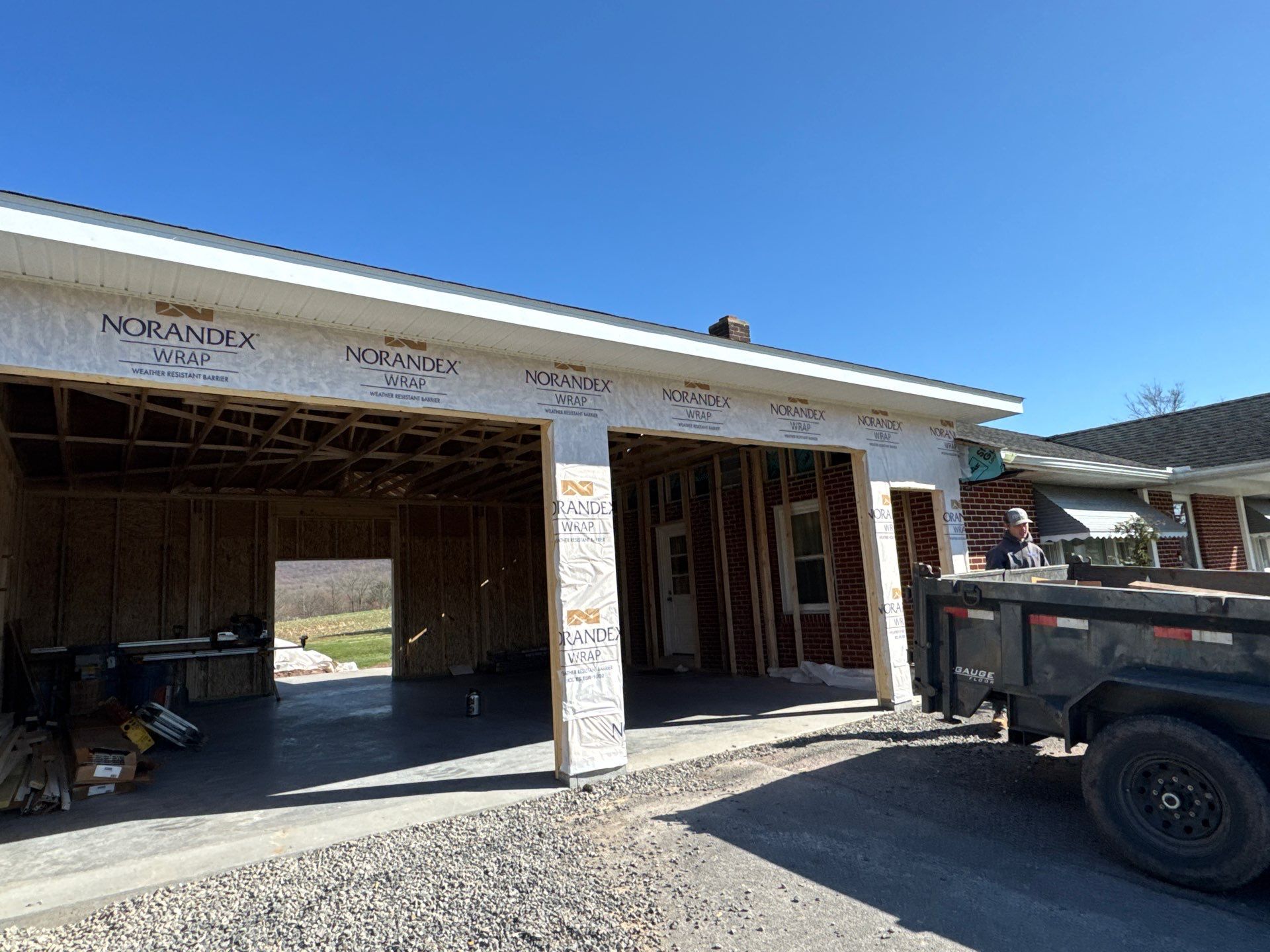 Tower City Residential Addition Featuring Gray Vinyl Siding and Garage by Esh Builders