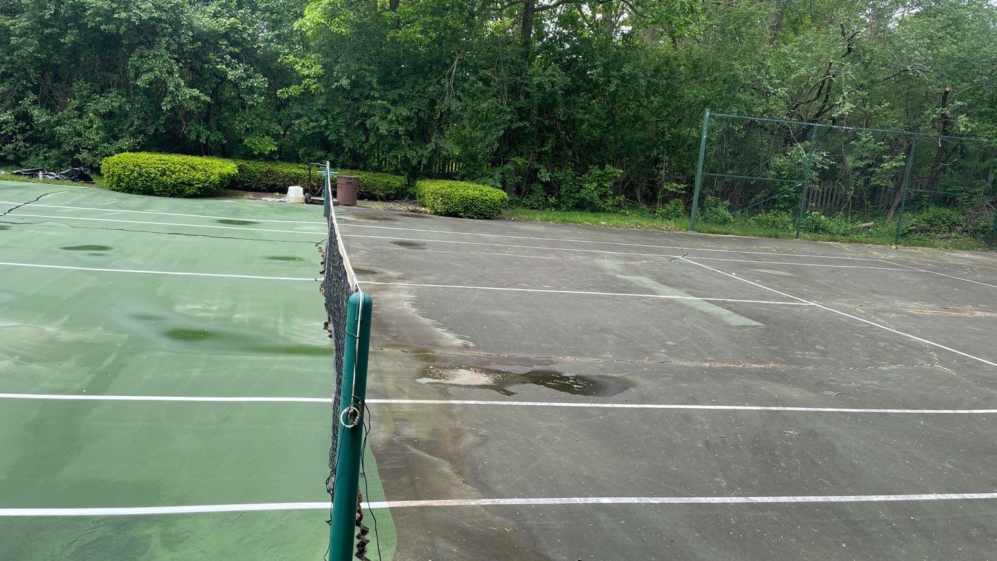 Tennis Court using Algaecide, soft wash soap by Northern Power Washing LLC.