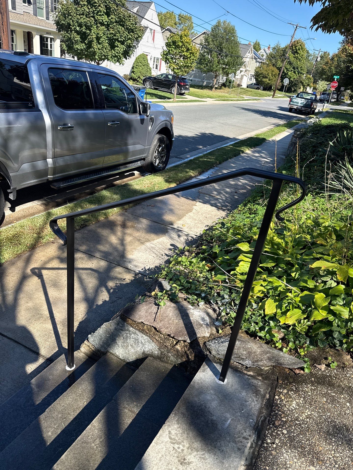 Custom Black Metal Porch and Step Railing Installation in Bethesda by Capitol Iron Works