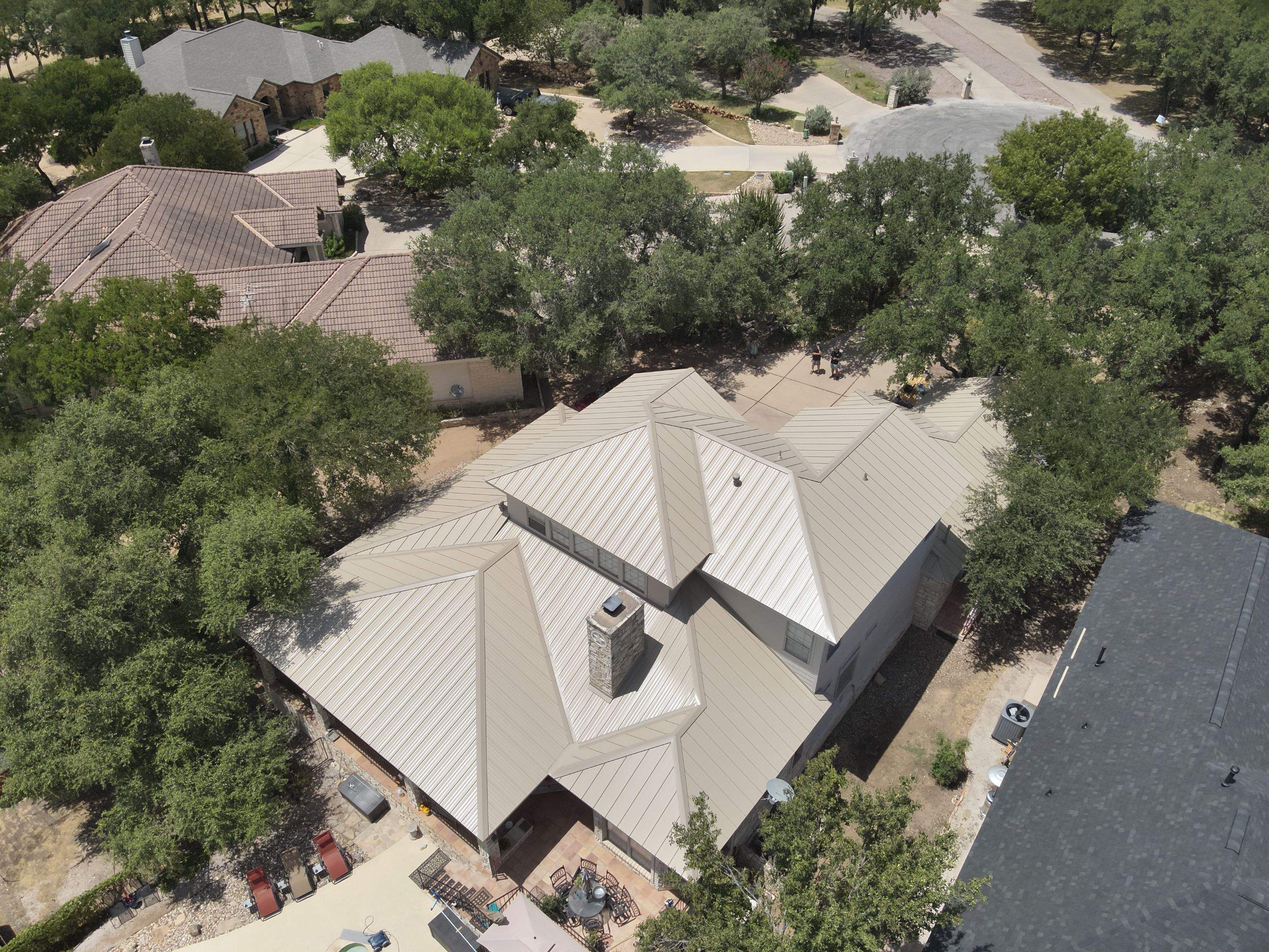 Residential Roof Replacement using 24 GA Double-Lock - Surrey Beige by Action Exteriors Austin