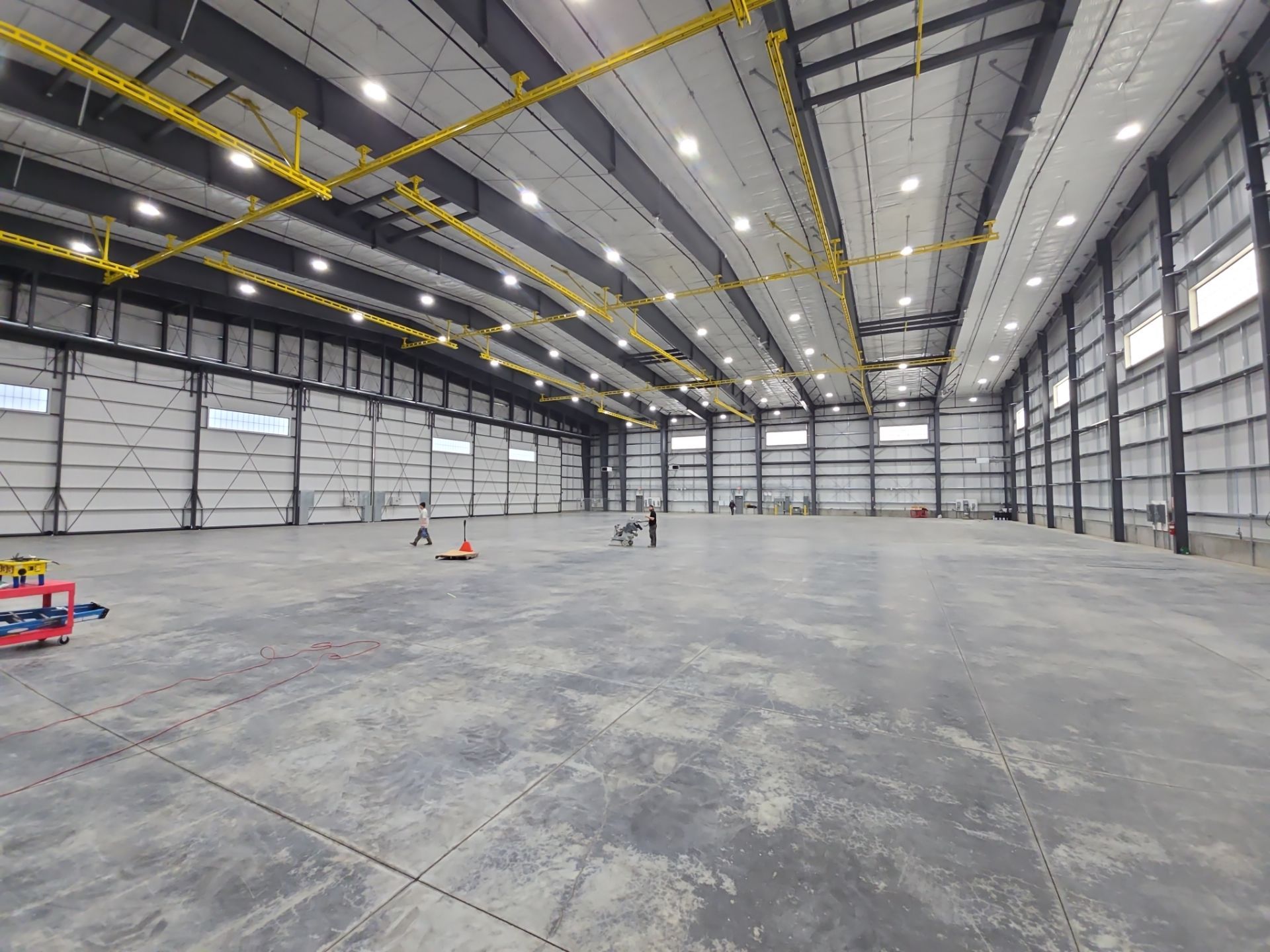 Airplane Hanger using Light Grey Commercial Penntek Epoxy by Croc Coatings, LLC