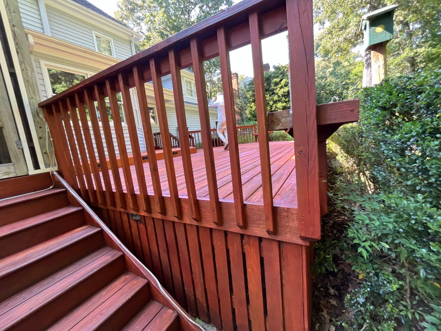 Triple deck re-staining by AKK Painting LLC