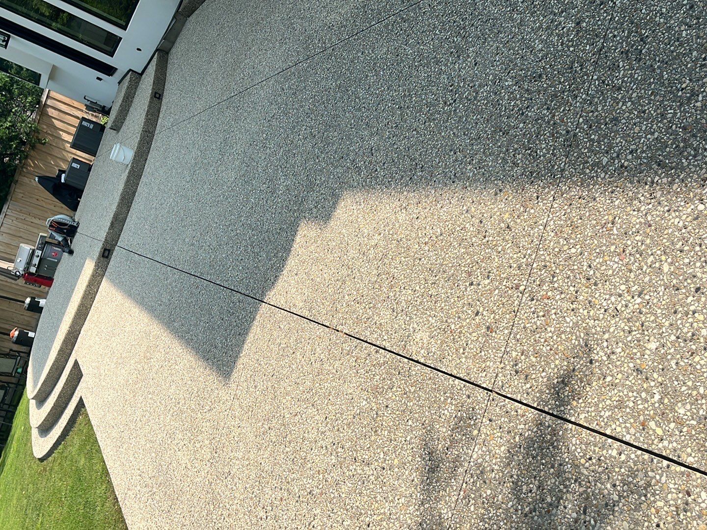 Aggregate concrete cleaning and sealing using Surebond SB-9000 by Northern Power Washing LLC.