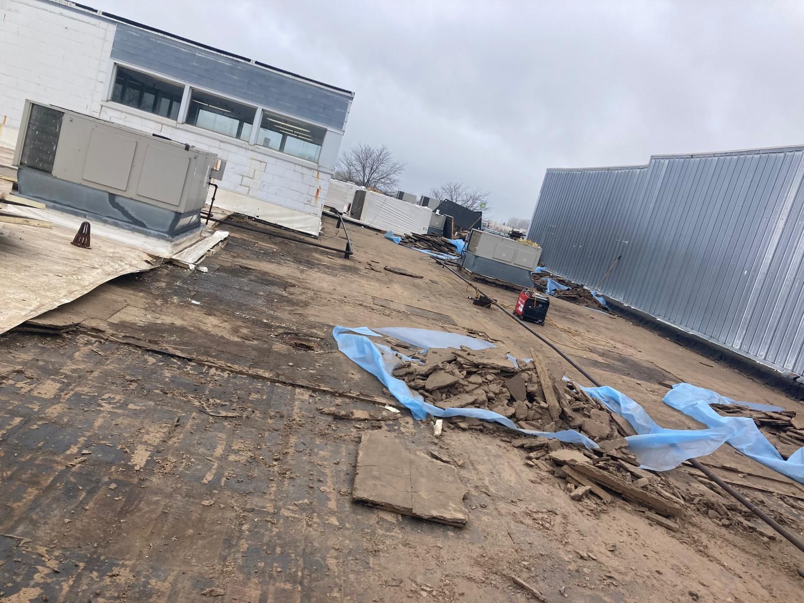 Full Roof Tear-off with new Code ISO insulation and 50 Mil Membrane by Grell Roofing
