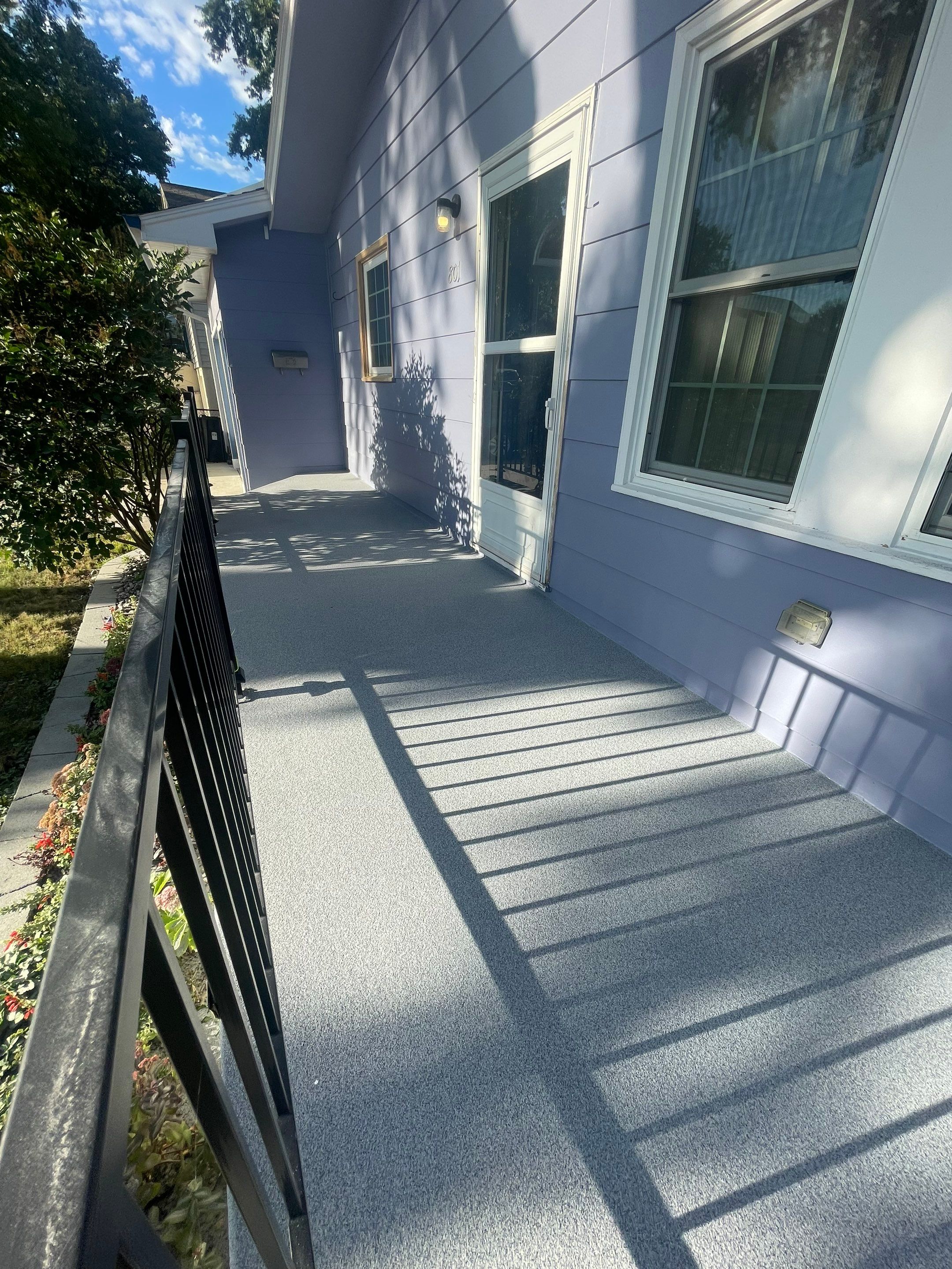 Sioux Falls Concrete Porch Coating with Starry Evening Finish by Select Painting, Coatings & Garage Cabinets