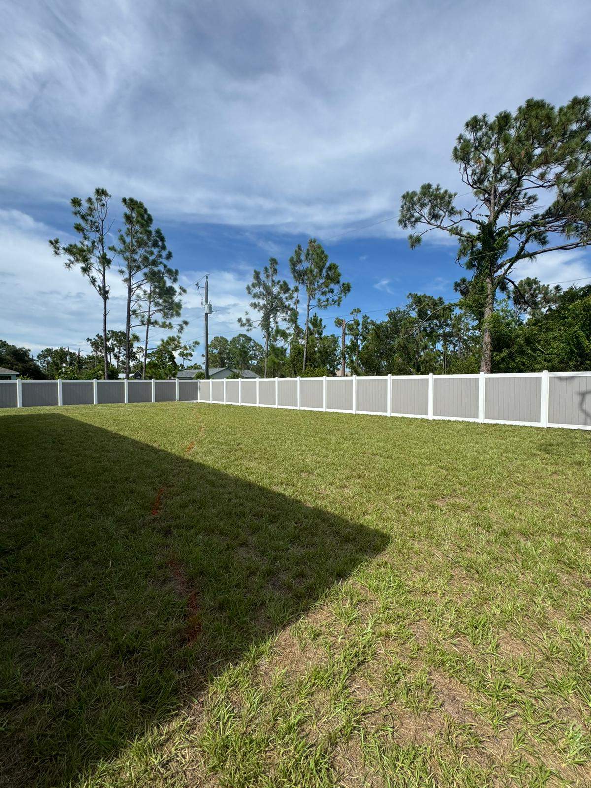 Two-Tone Vinyl Privacy Fence Installation in Port Charlotte by True Fence LLC