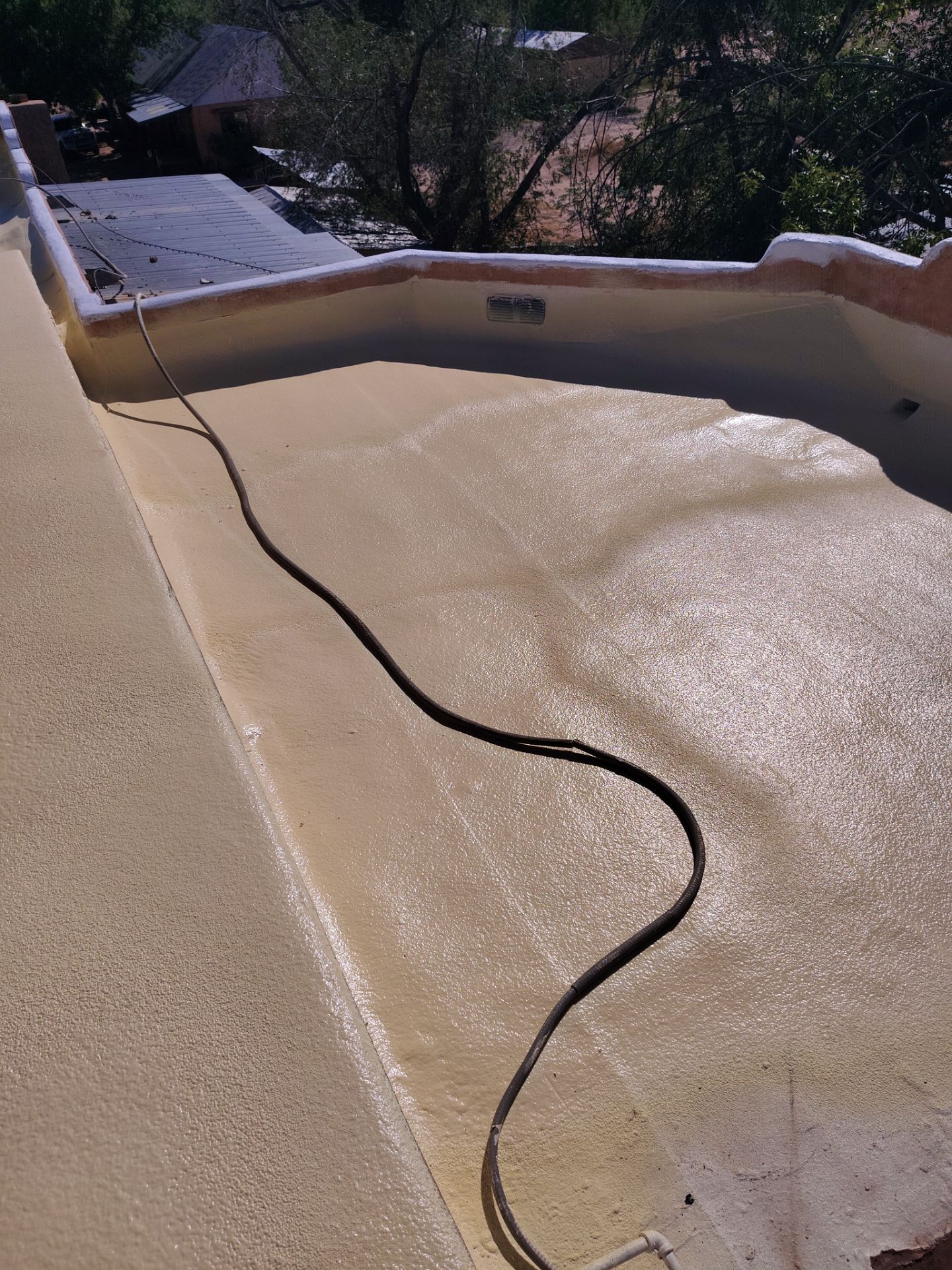 Residential roof application by SPF Services 