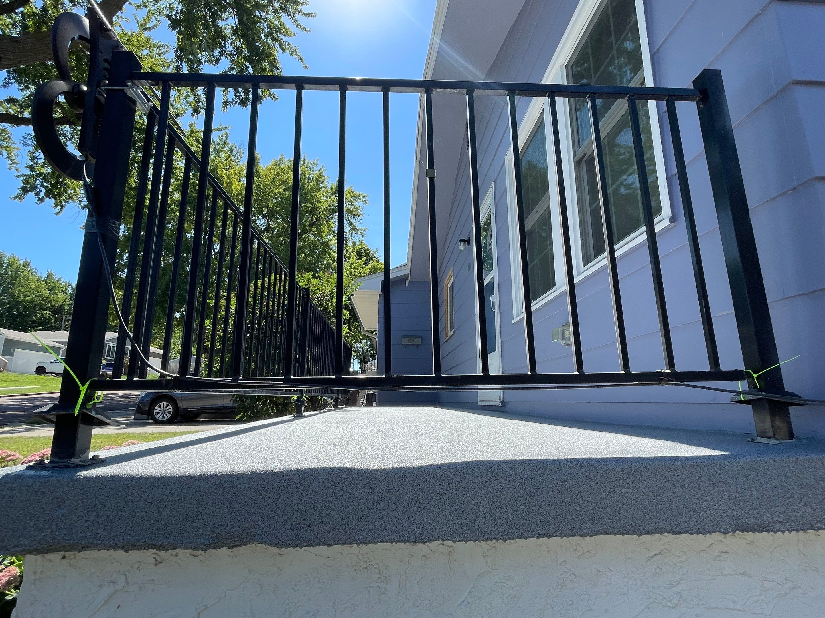 Sioux Falls Concrete Porch Coating with Starry Evening Finish by Select Painting, Coatings & Garage Cabinets