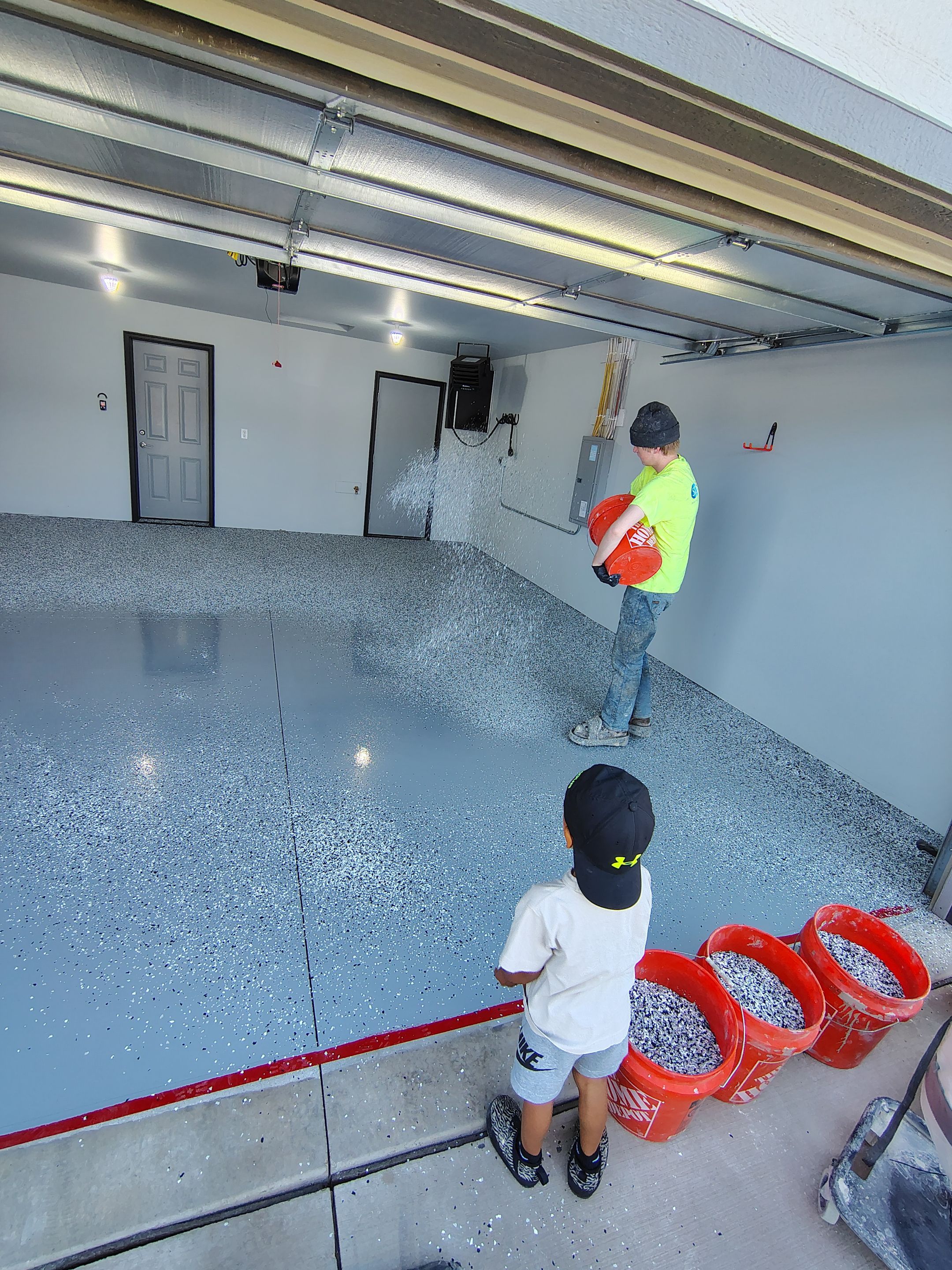 Custom Epoxy Garage Floor Coating Installation in Sioux Falls by Select Painting, Coatings & Garage Cabinets