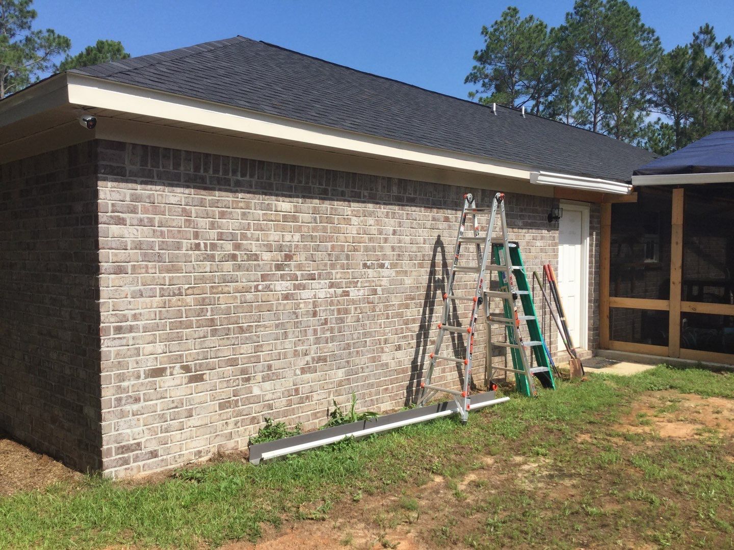 Downspout Installation using White Down Spouts in Milton FL by Gutter Professors