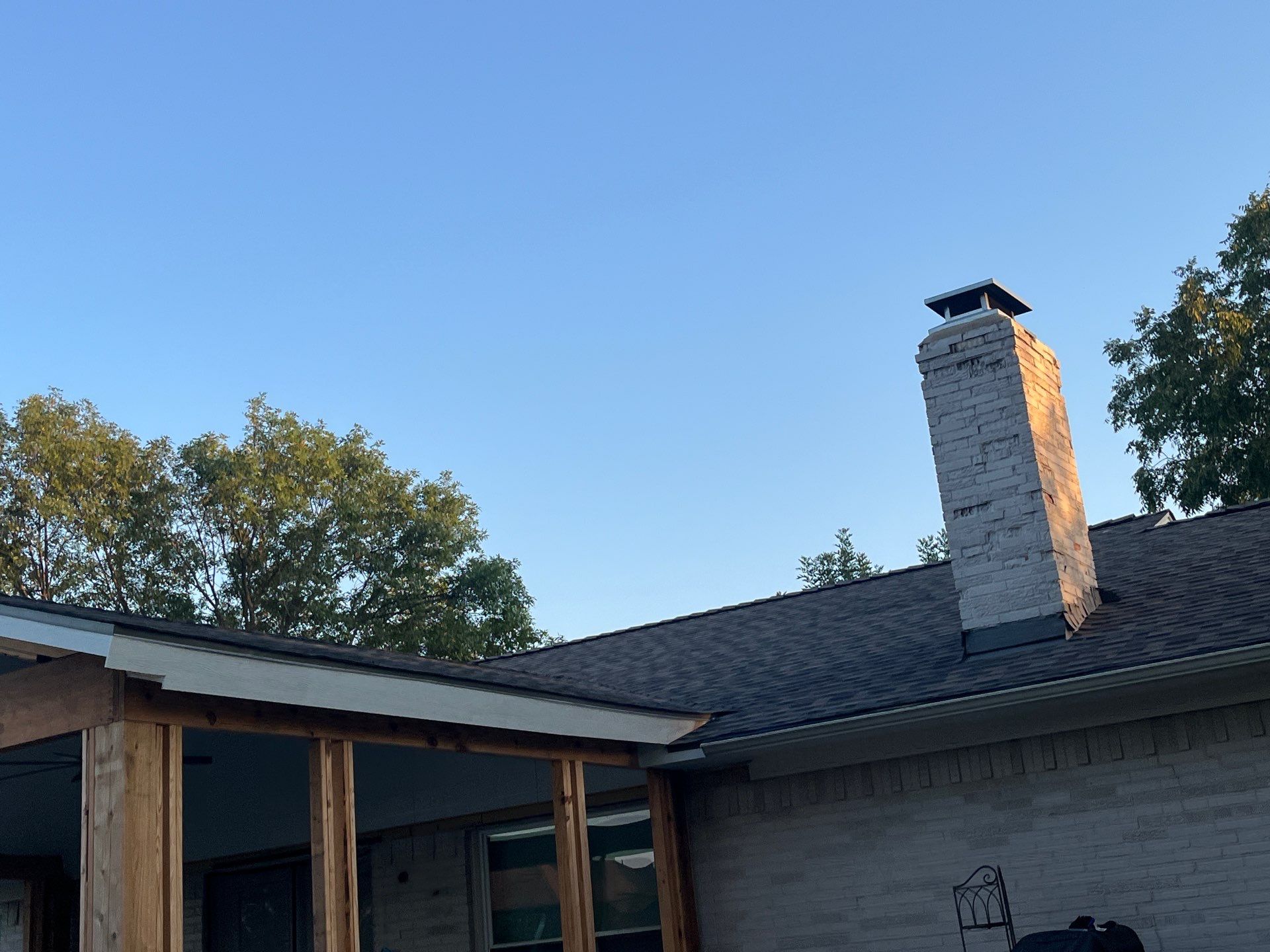 IKO Driftshake-Light Cream brick house by Tejas Roofworks + Restoration