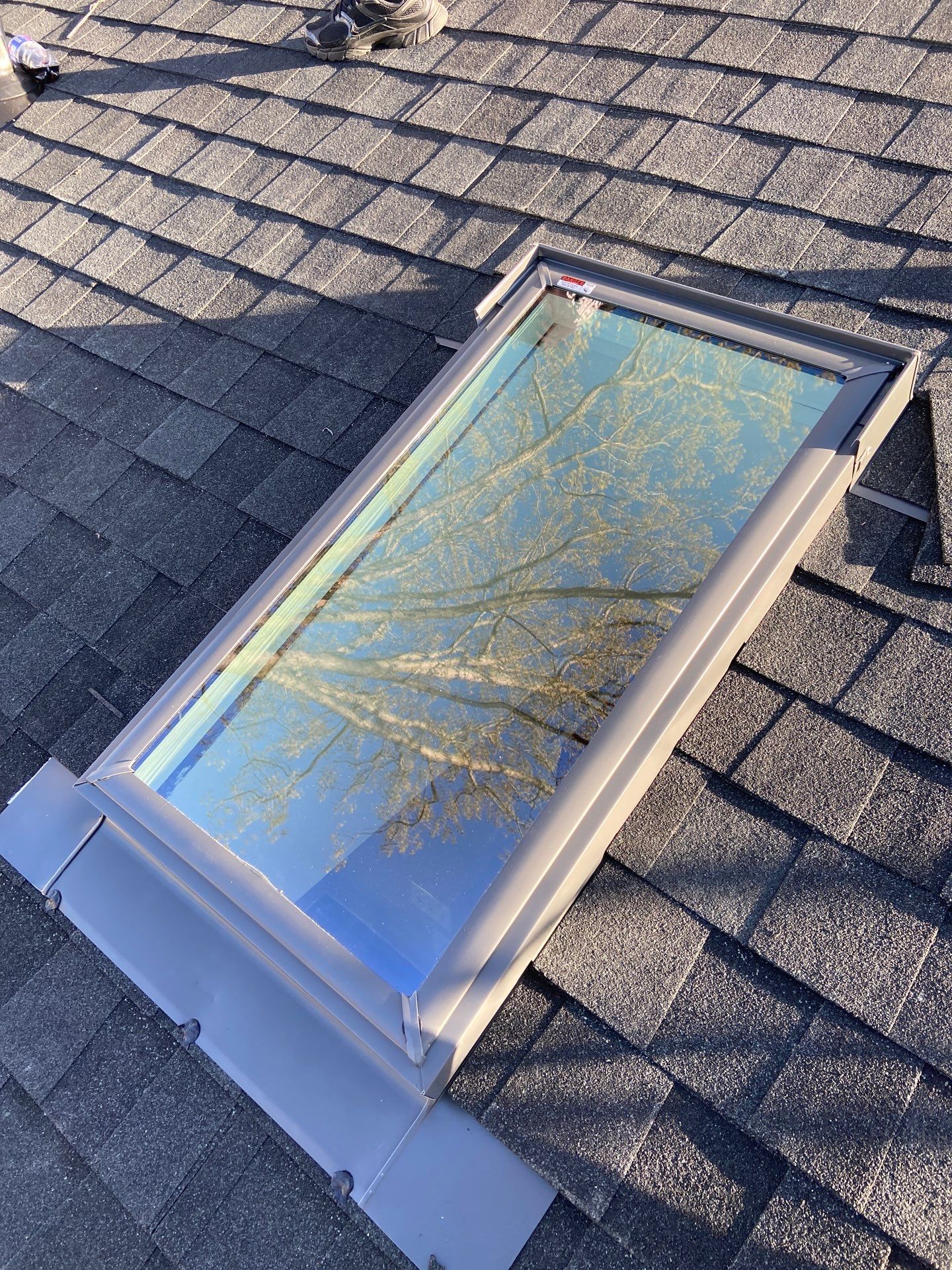 Skylight Installation and Residential Roof Installation using TAMKO TITAN - Rustic Black by Storm Ready Exteriors