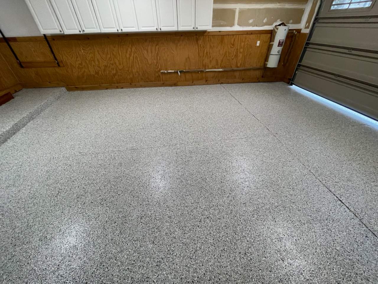 Garage Renovation with Polyaspartic Flooring and Custom Painting in Troy by Top Shelf Painter