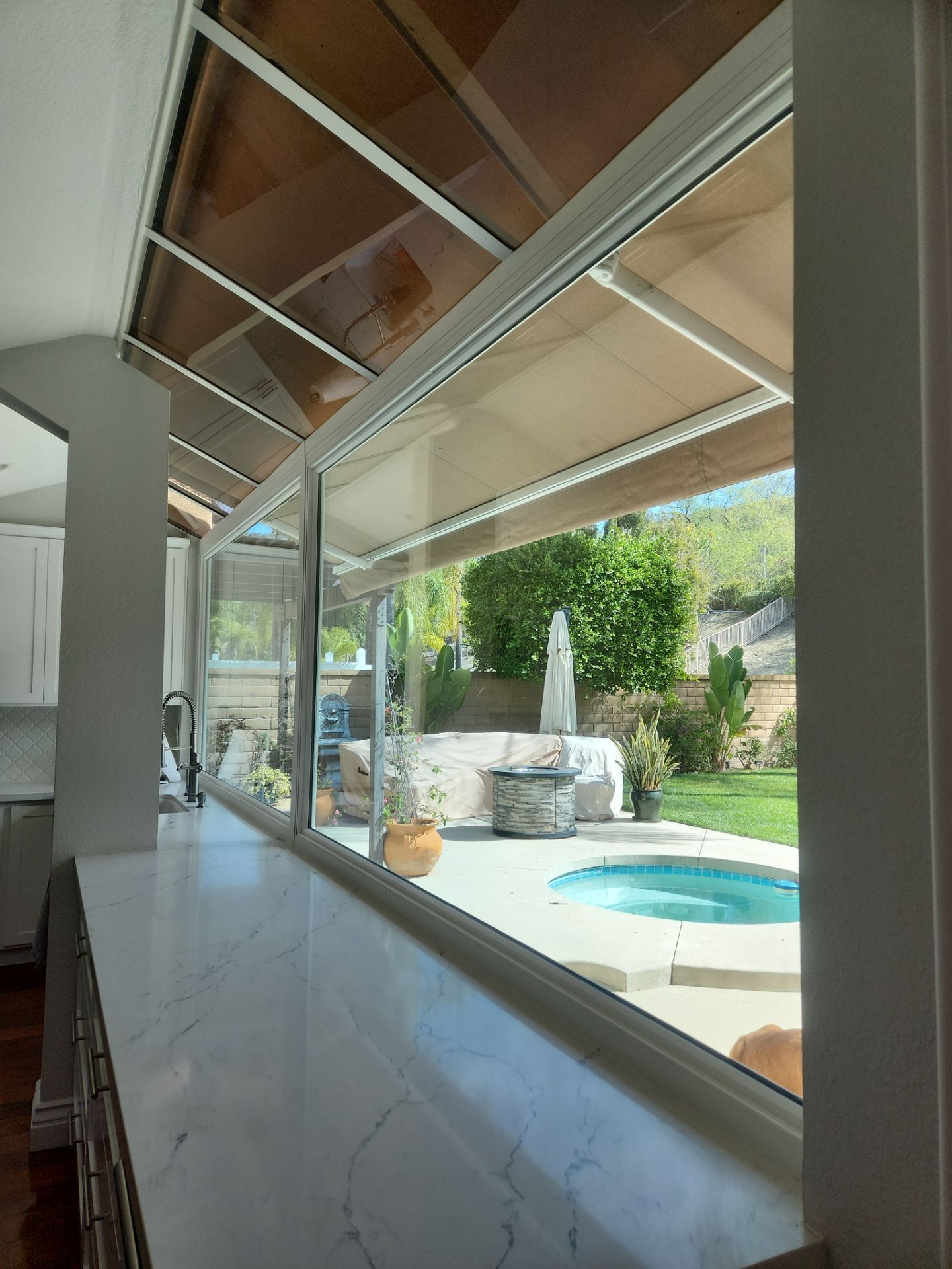 Window Installation using Anlin vinyl windows with Sunshield glass by American Window Company