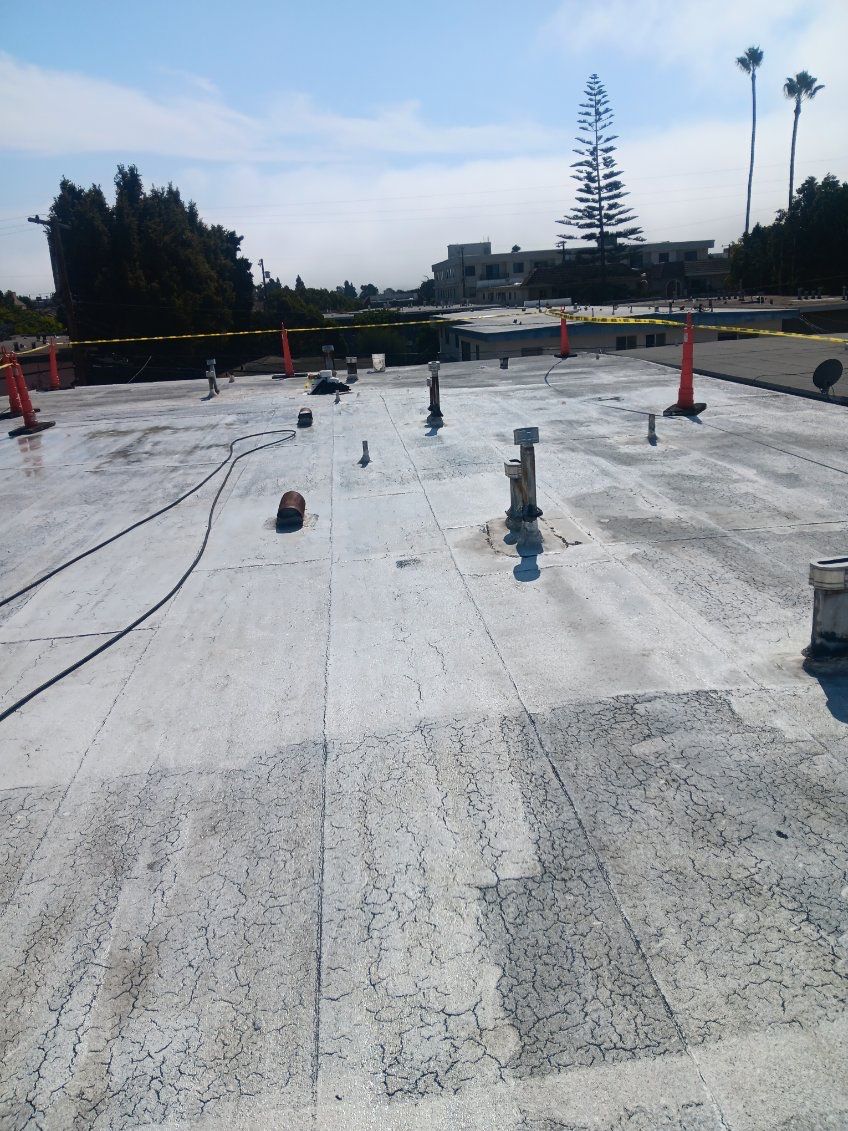 Commercial Roofing Installation using Silicone Coating by Hull Brothers Roofing