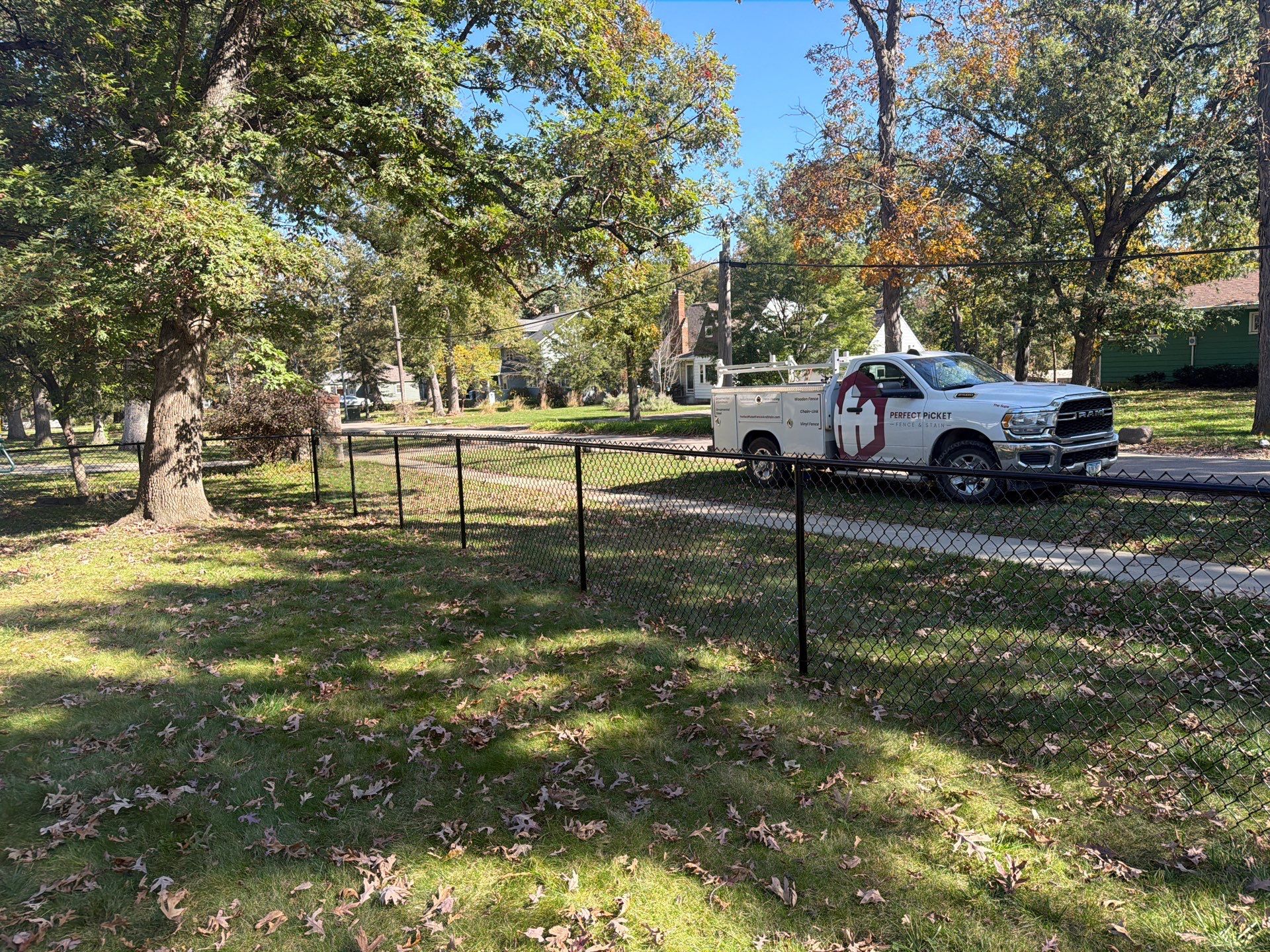 Residential Black Chain Link Fencing in Cedar Falls by Perfect Picket Fence and Stain