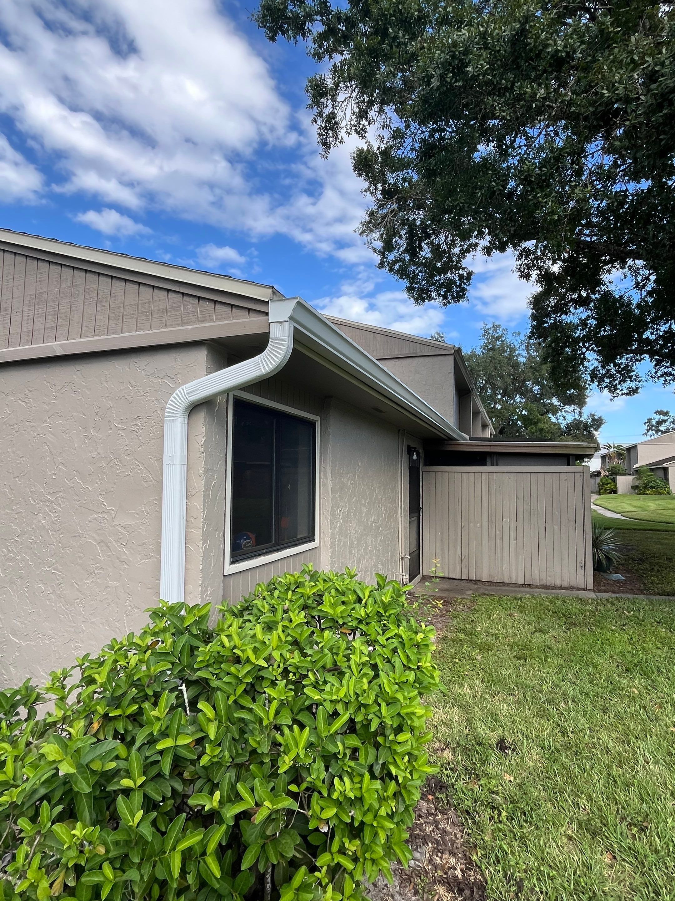 Professional Downspout Installation in Tampa, FL by Gutter Professor by Gutter Professors