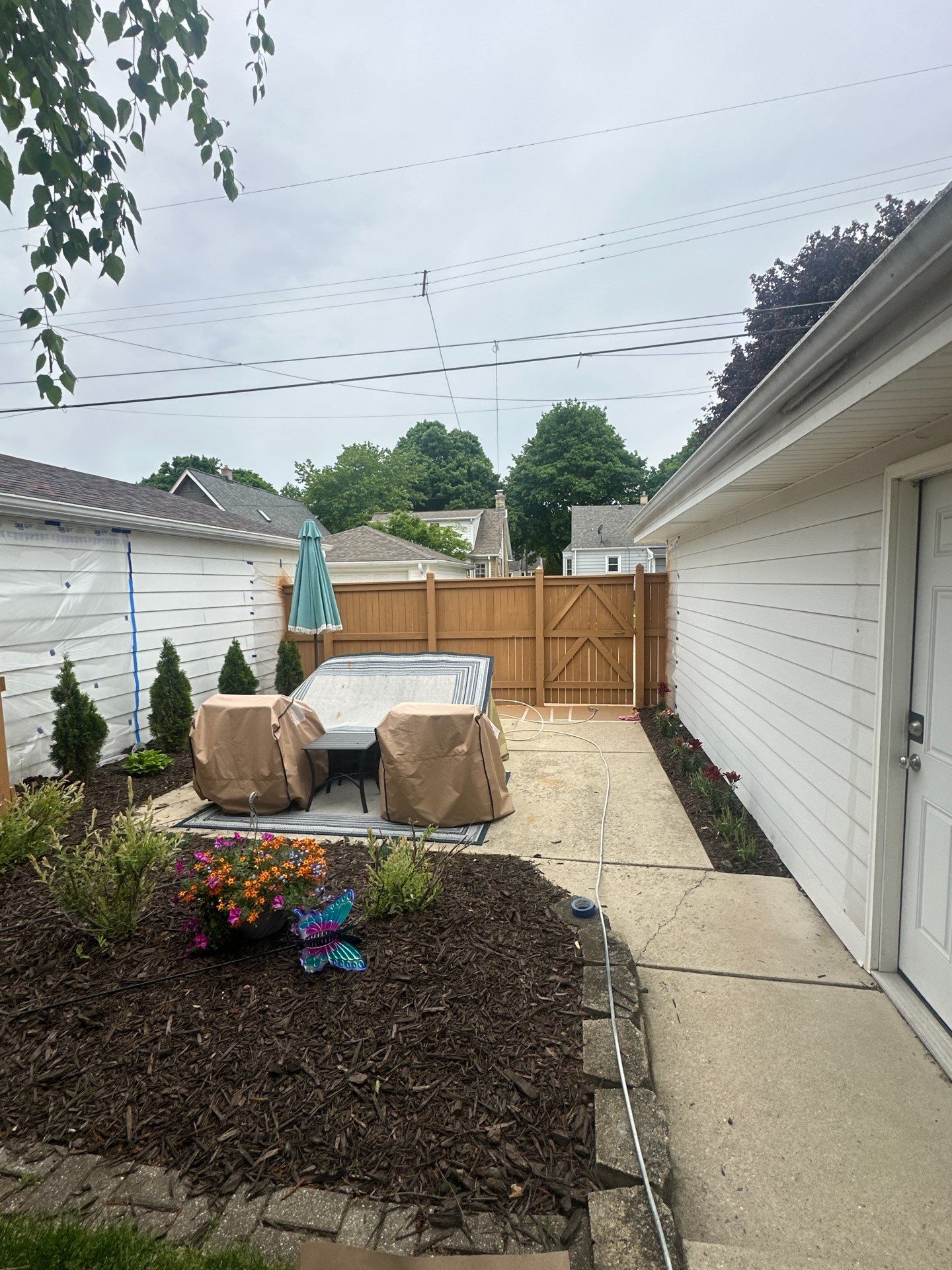 Milwaukee Wood Privacy Fence Installation and Concrete Patio Upgrade by OCS Contracting Services