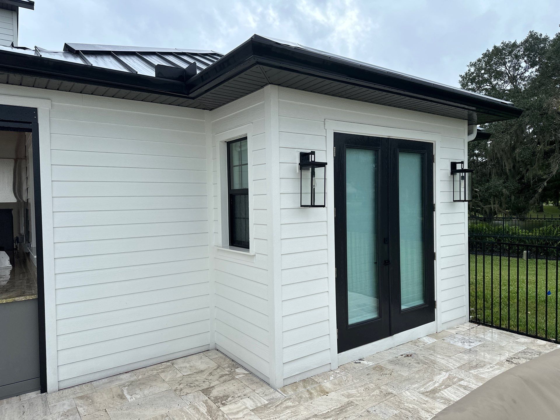Complete Two-Story House Wash and Driveway Cleaning in Winding River Community, Bradenton, FL by Sunshine AquaWash