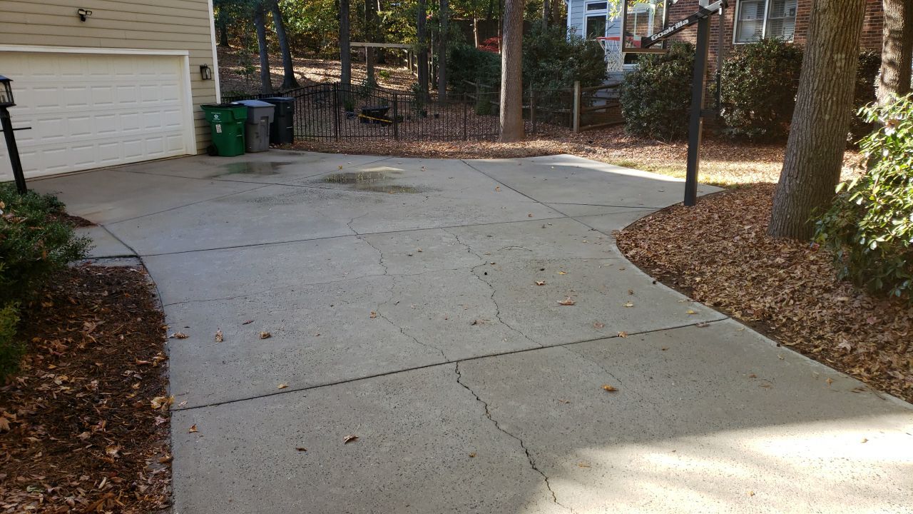 Driveway Clean using cleaner by Power Wash Masters LLC