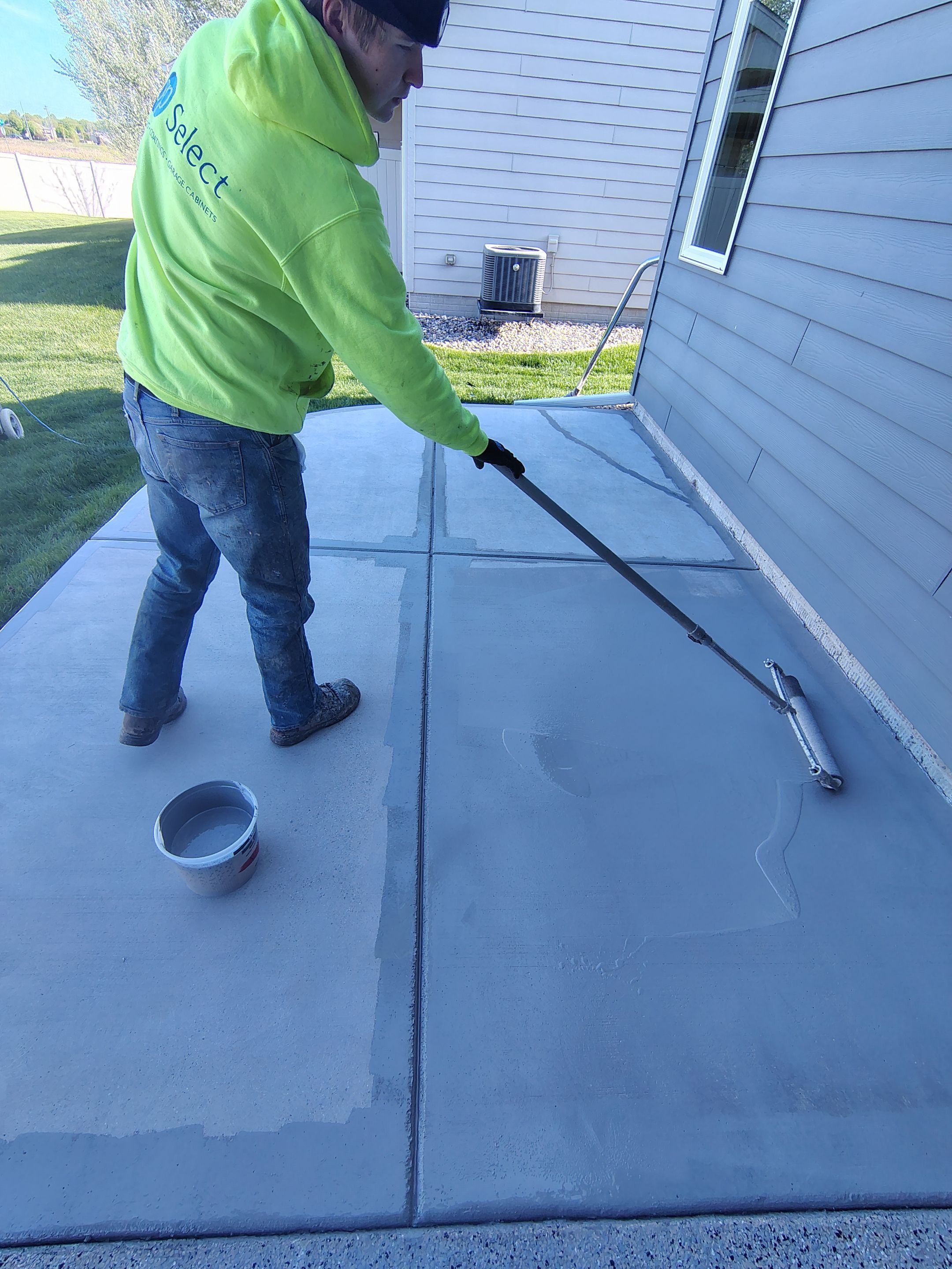Speckled Concrete Patio Coating Installation in Sioux Falls by Select Painting, Coatings & Garage Cabinets
