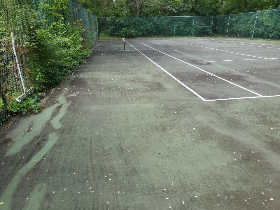 Tennis court cleaning by Northern Power Washing LLC.