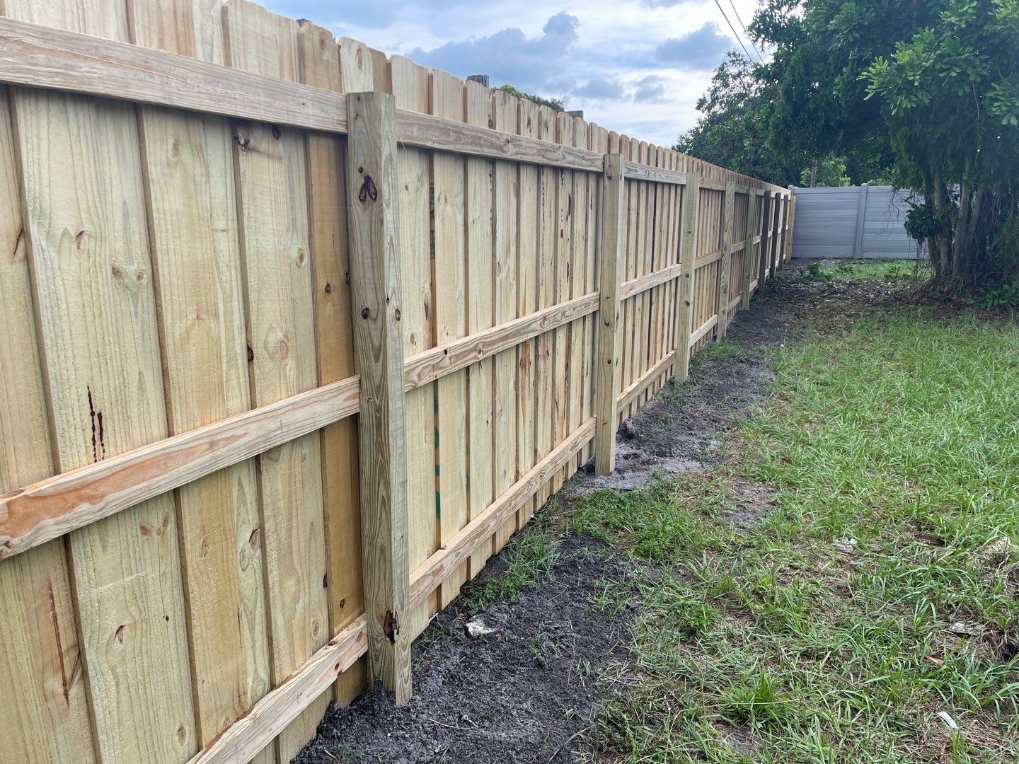 Sarasota, FL 6ft. Tall Treated Board on Board Wood Fence by Asap fence and gates, LLC