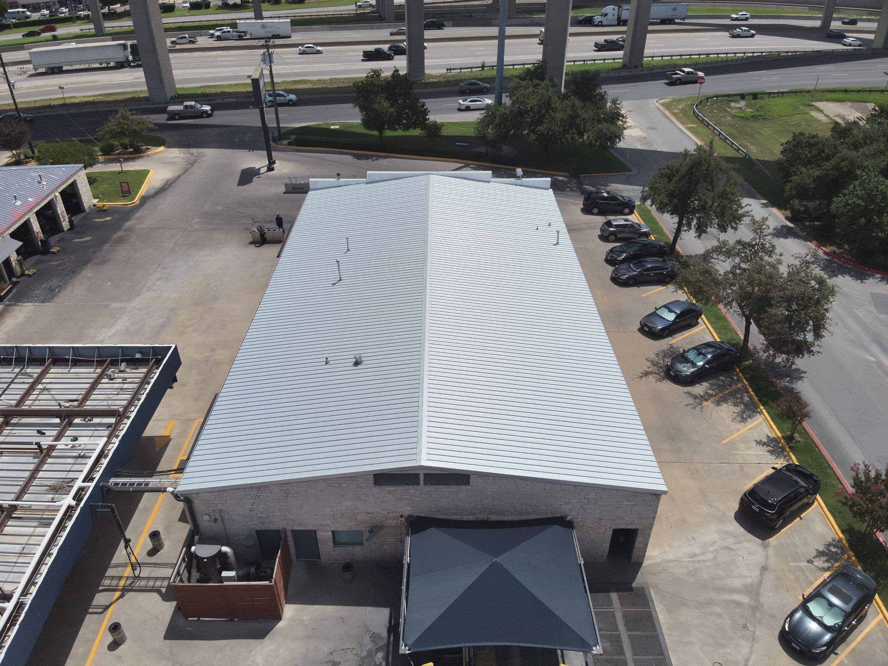 Commercial Roofing Installation using Metal Standing Seam U Panel by Action Exteriors Austin