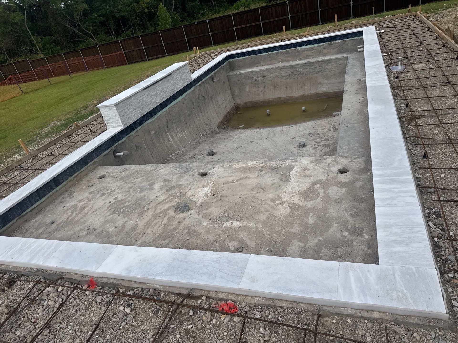Modern Geometric Pool with Raised Wall Feature by Pinnacle Pools and Spas - DFW