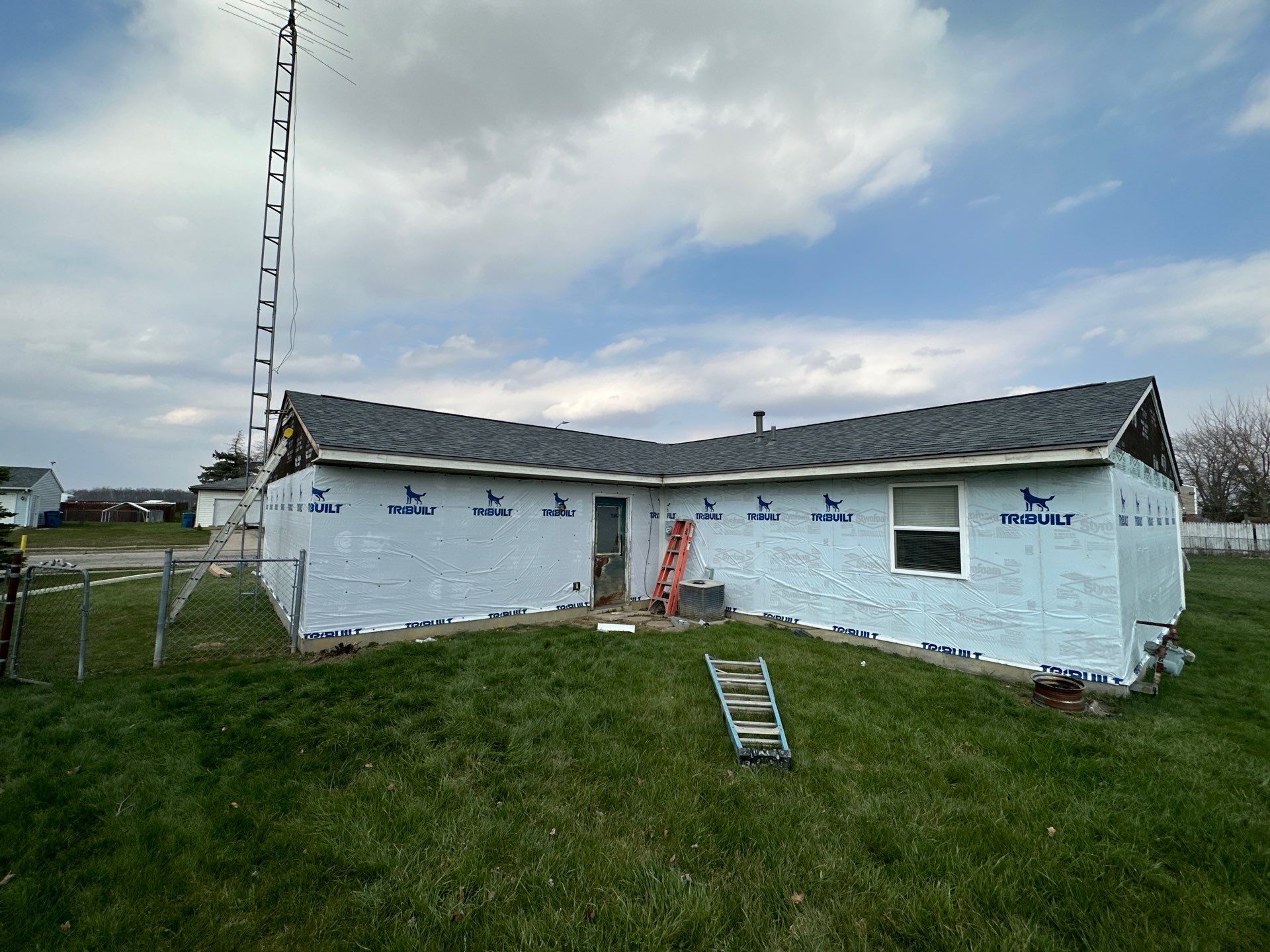 Storm Damage Residential Roof and Siding Installation by WIW Enterprises Inc