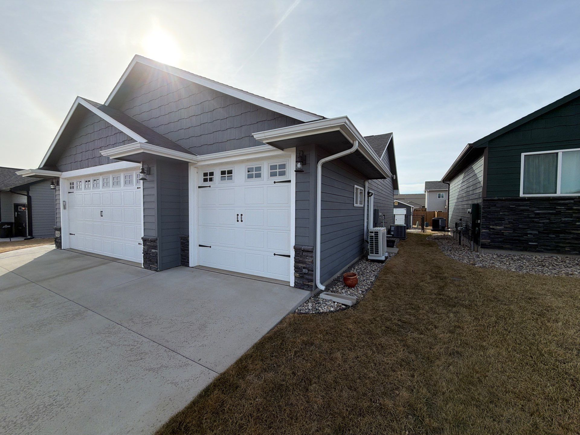 Residential Exterior Painting and Siding Refresh in Sioux Falls by Select Painting, Coatings & Garage Cabinets