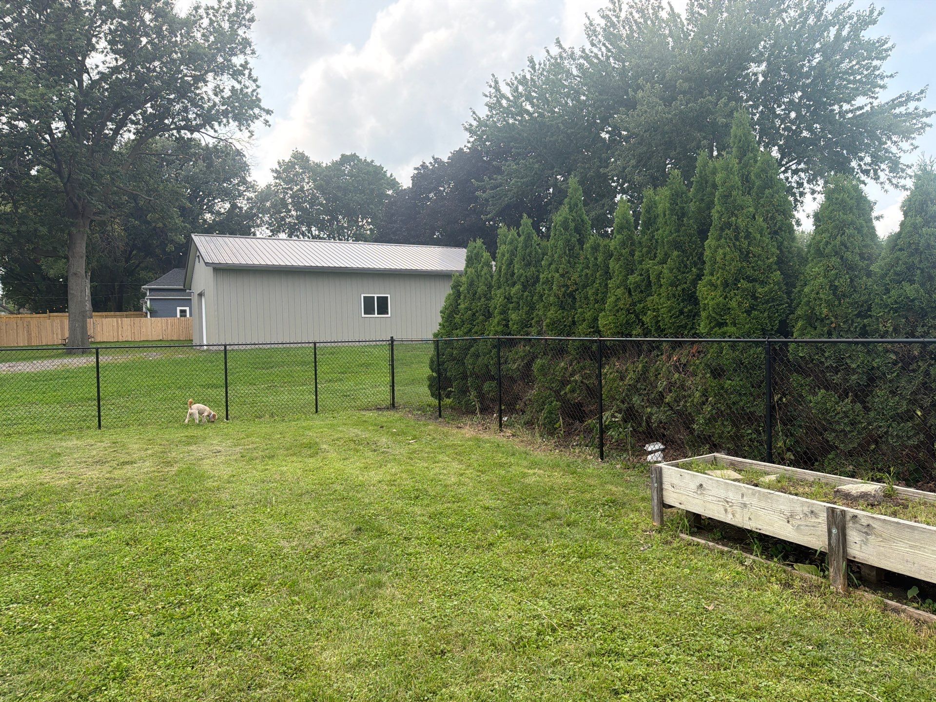 Residential Black Chain Link Fence Installation in Reinbeck by Perfect Picket Fence and Stain