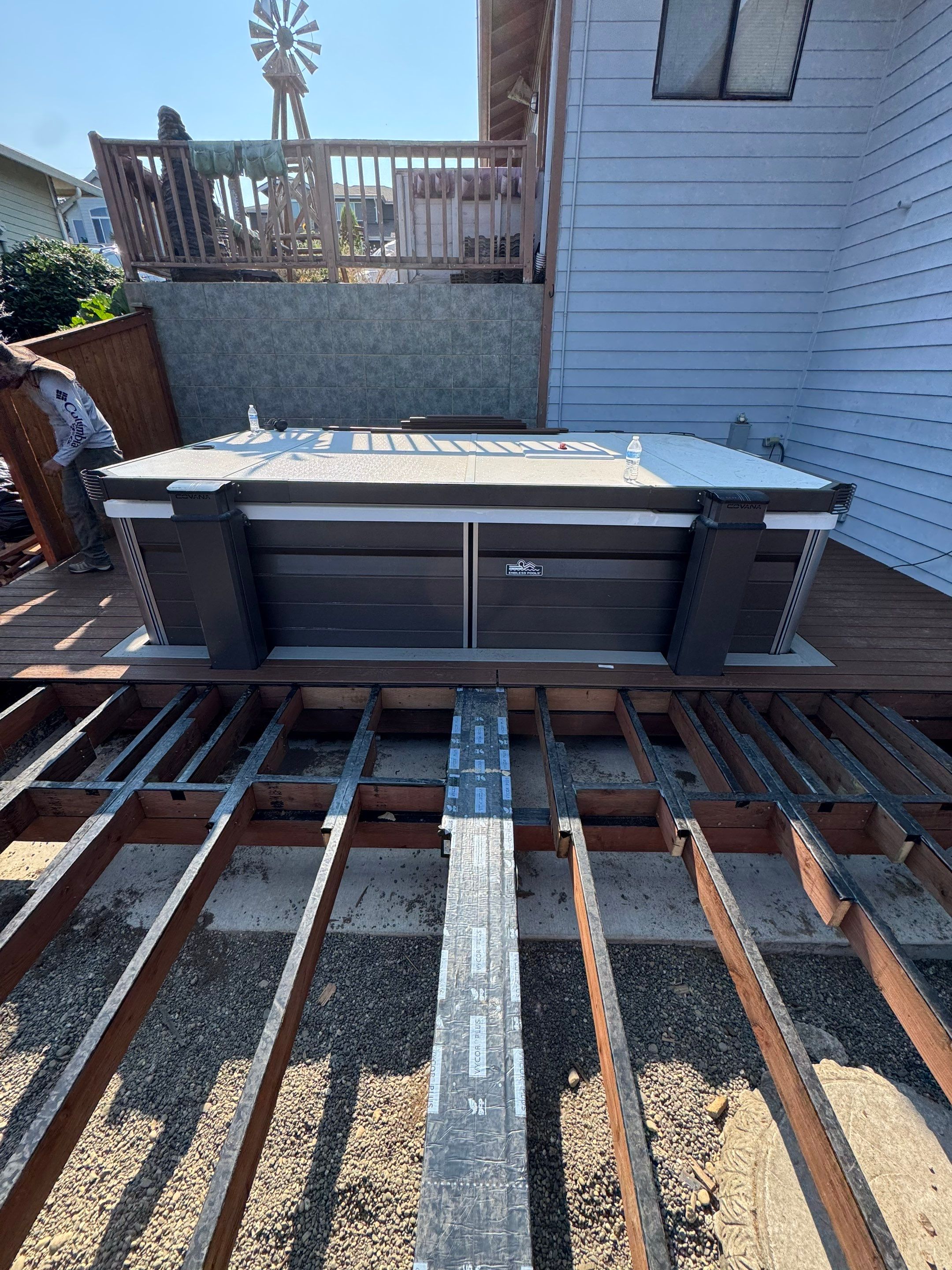 Tacoma Custom Composite Deck and Hot Tub Surround with Retaining Wall by Emerald City Energy 