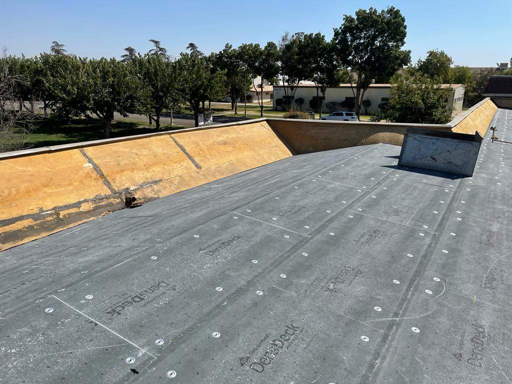 Commercial Roofing Installation using General Coatings acrylic coatings and spray foam by Straight Edge Roofing Inc