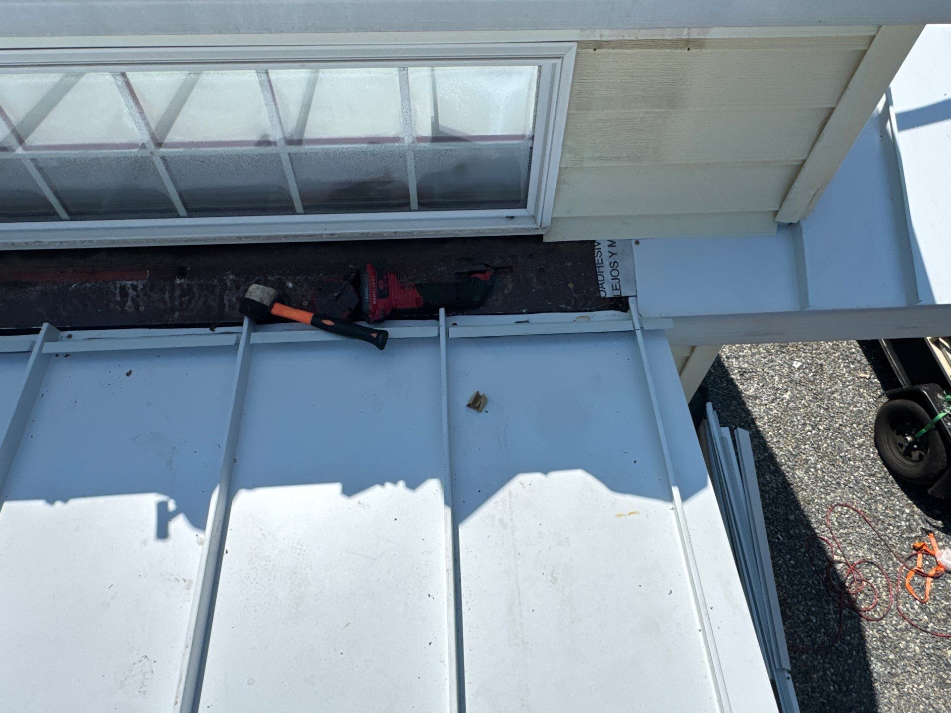 White Standing Seam Metal Roof Installation in Wake, VA by Cade Construction
