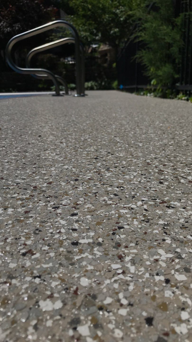 Pool Deck using Pebble Beach by Select Painting, Coatings & Garage Cabinets