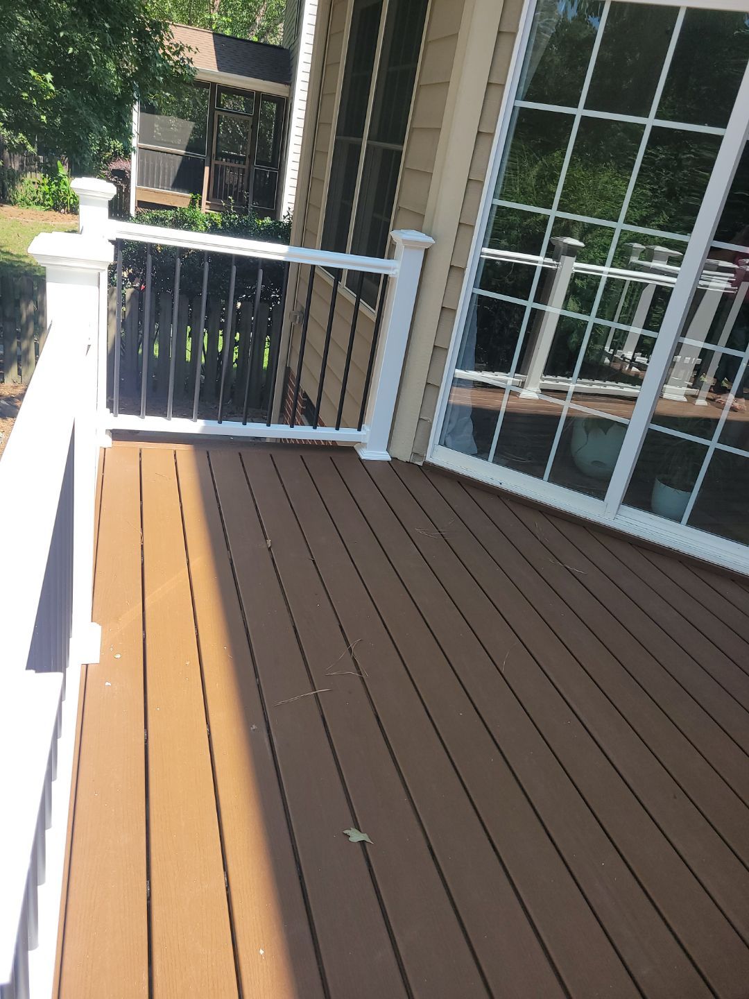 Fuquay-Varina Outdoor Upgrade – Composite Deck & Paved Landing by Elite Remodeling and Design LLC