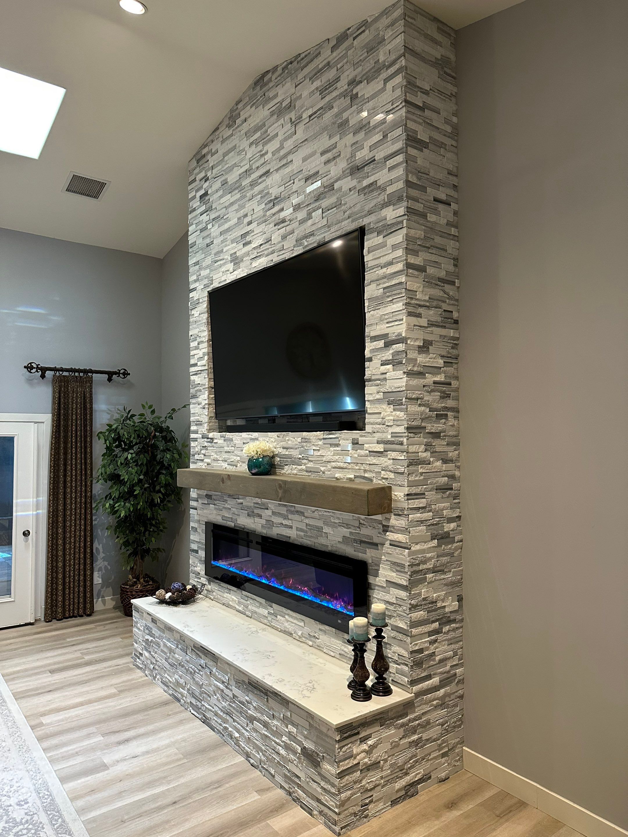 Stacked Stone Electric Fireplace by Footprints Floors of Chandler 