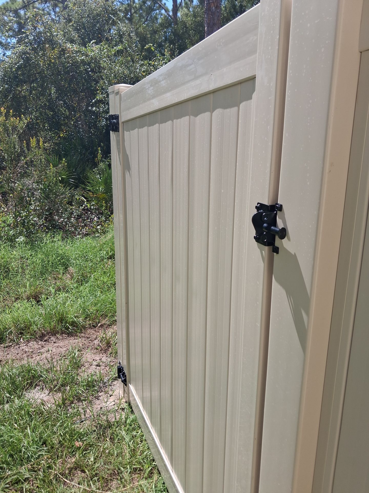 Tan Vinyl Privacy Fence and Gate Installation in Port Charlotte by True Fence LLC