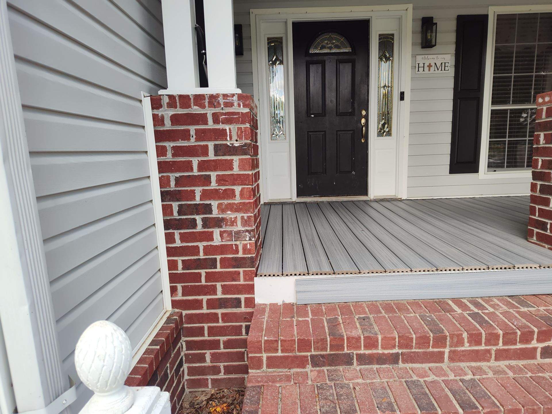 Outside porch and concreate work by Cornerstone Home Builders, LLC