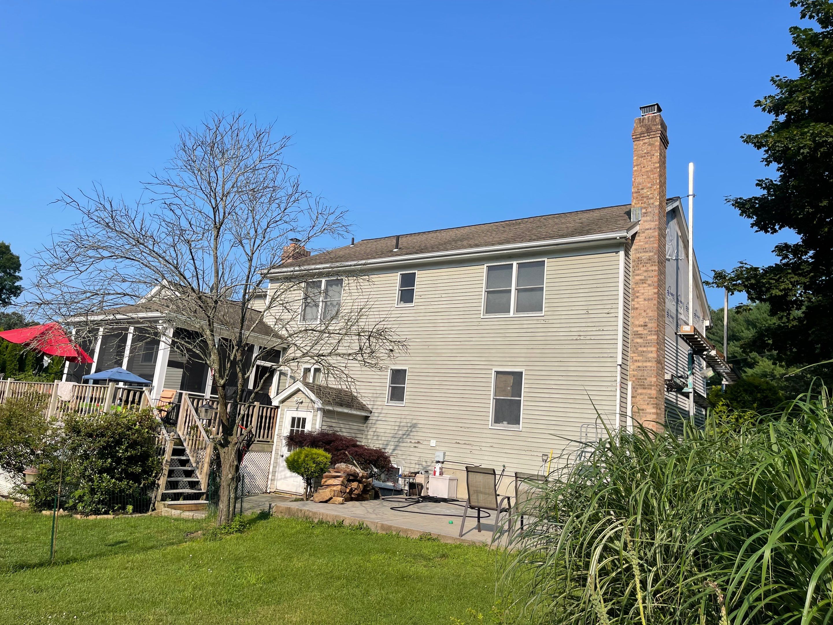 Siding Installation using Mainstreet Colonial & White gutters by A Plus Exterior