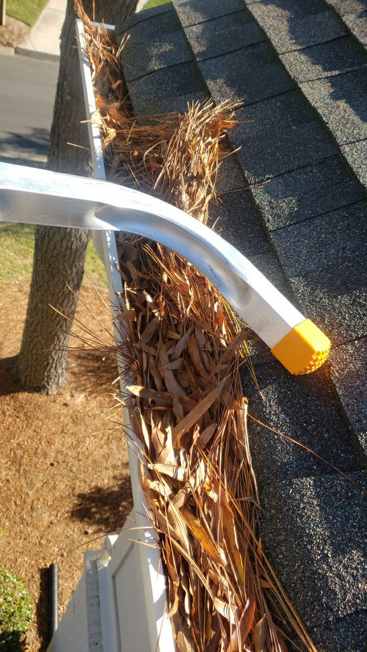 Sara Gutter cleanout using water by Power Wash Masters LLC