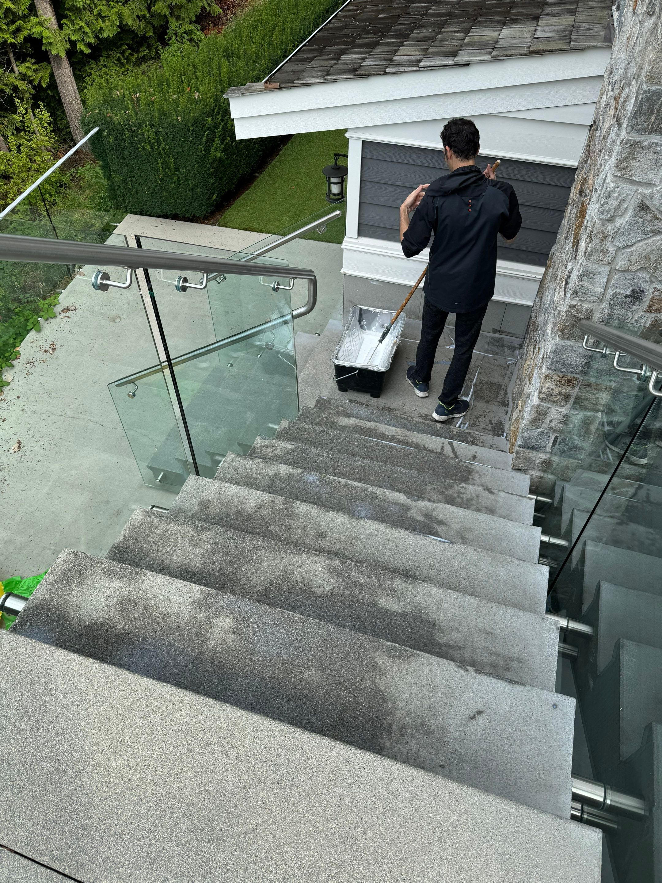 Applying Concrete Sealer  by YVR Construction Group