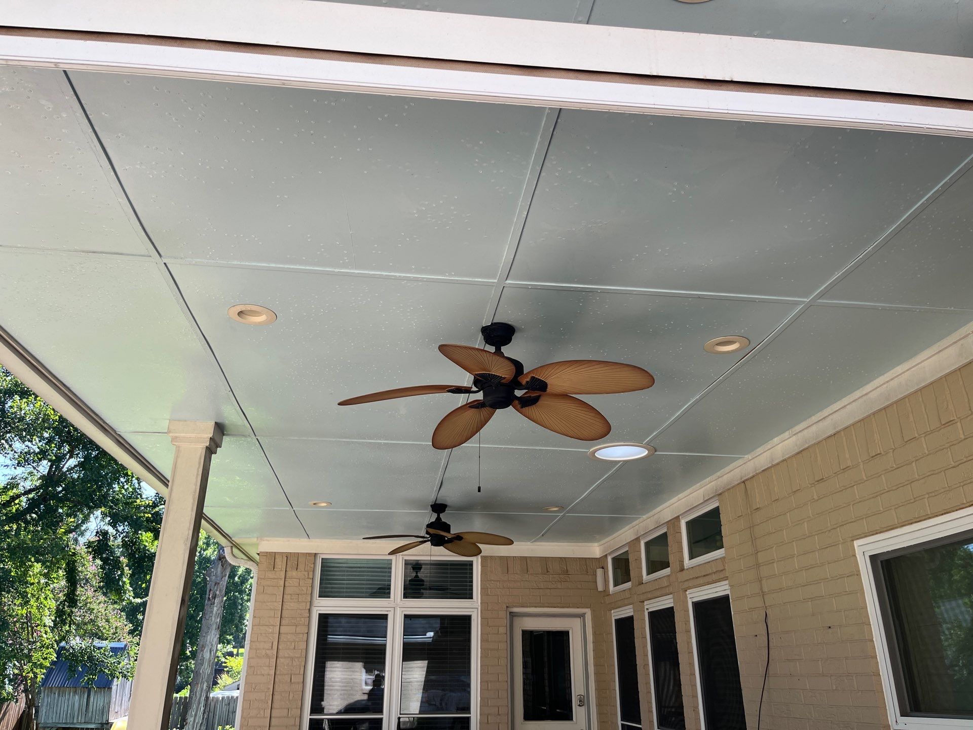 Exterior Painting in Tyler, TX | Brick House with White & Blue Finish by Quality Coats Painting